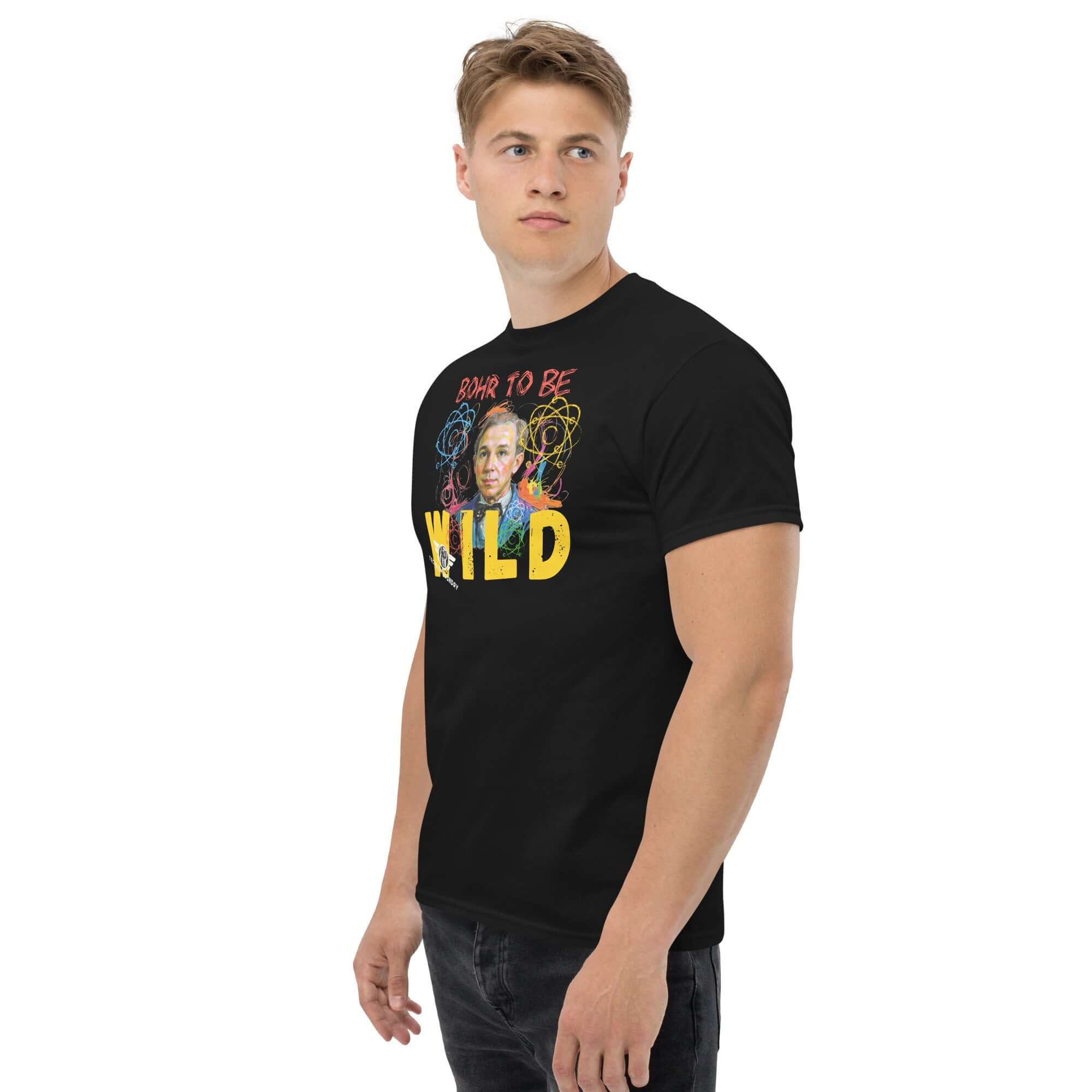 Man wearing 'Bohr to Be Wild' T-shirt featuring Niels Bohr in a rock & roll style with atomic design, blending science and art.