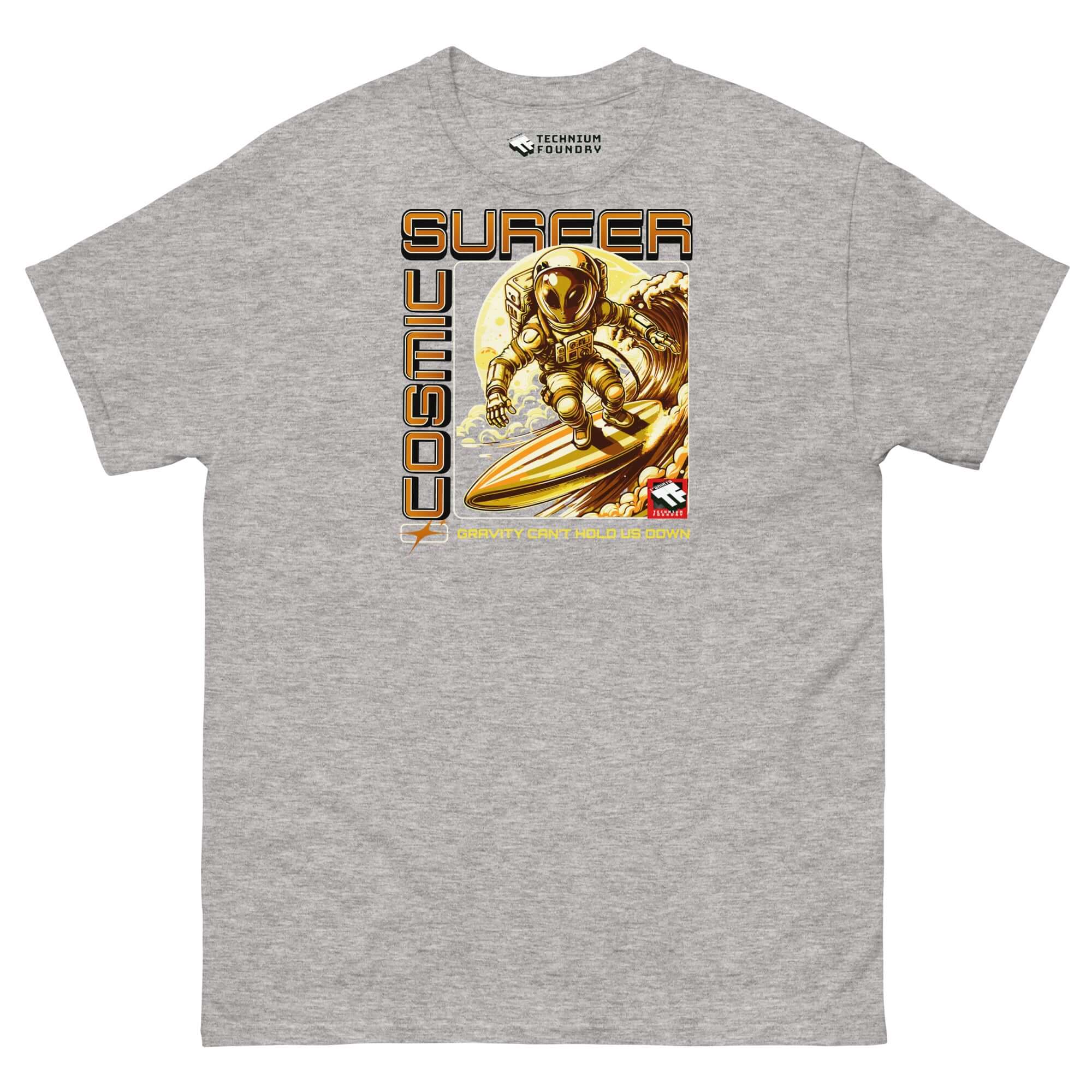 Cosmic Surfer T-Shirt by Technium Foundry featuring astronaut surfing in space, retro-tech gold tones, with "Gravity Can't Hold Us Down" tagline.
