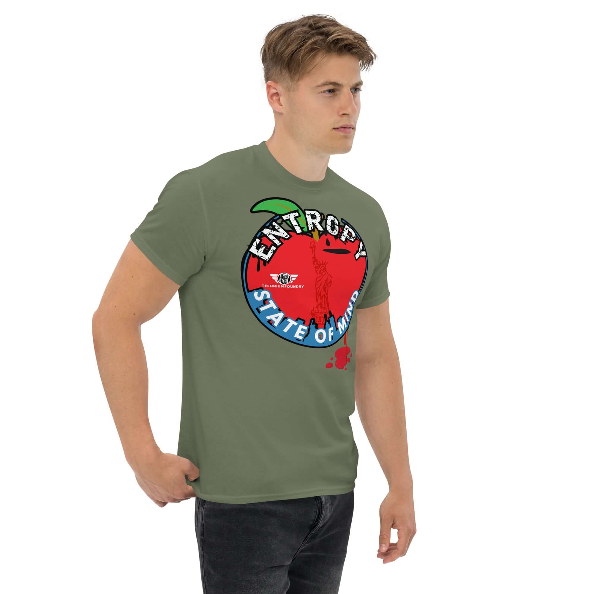 Man wearing 'Entropy State of Mind' NYC thermodynamics t-shirt, featuring Lady Liberty and chaos theory, green tee with bold graphics.