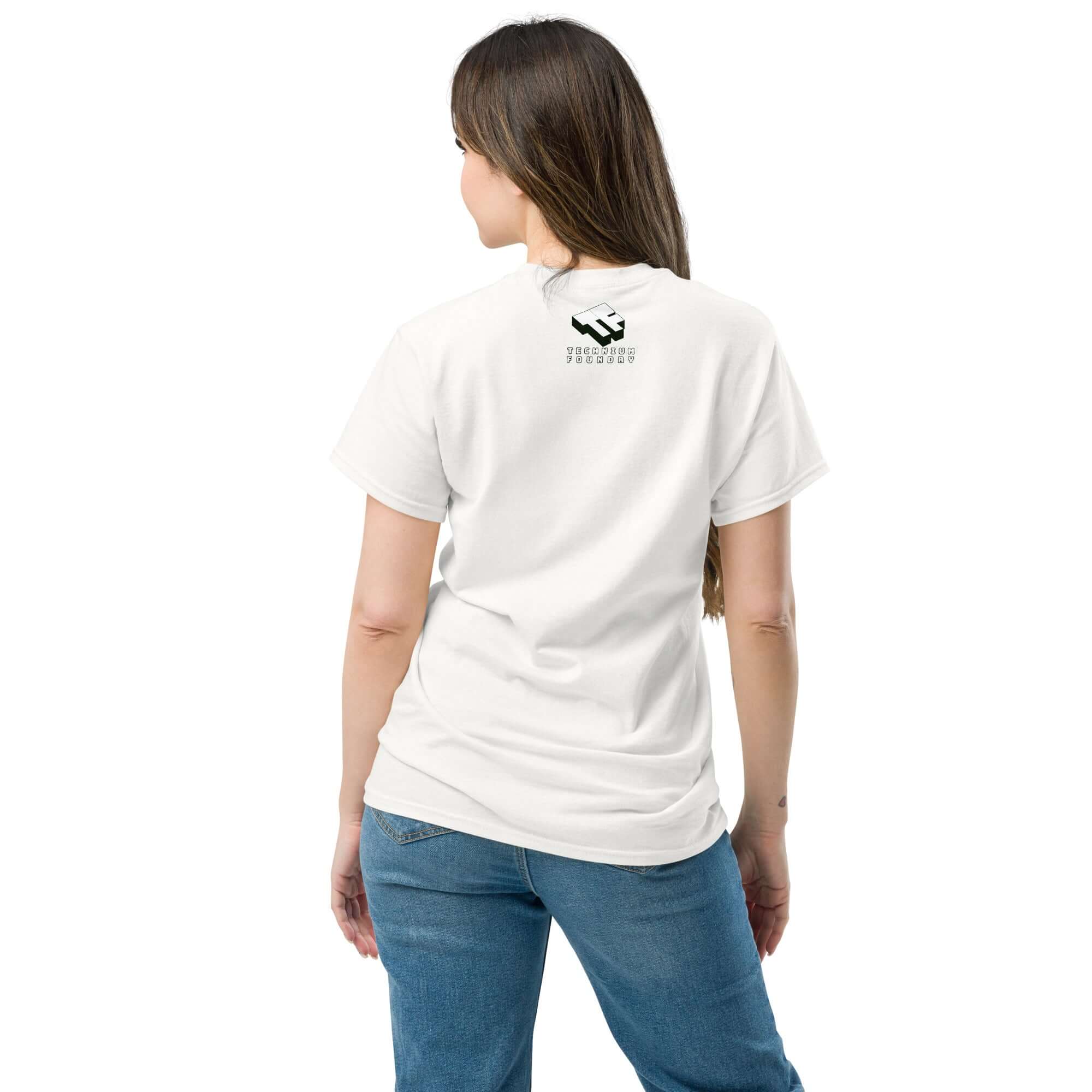 Back view of woman wearing a white t-shirt and blue jeans, displaying a small graphic on the upper back.