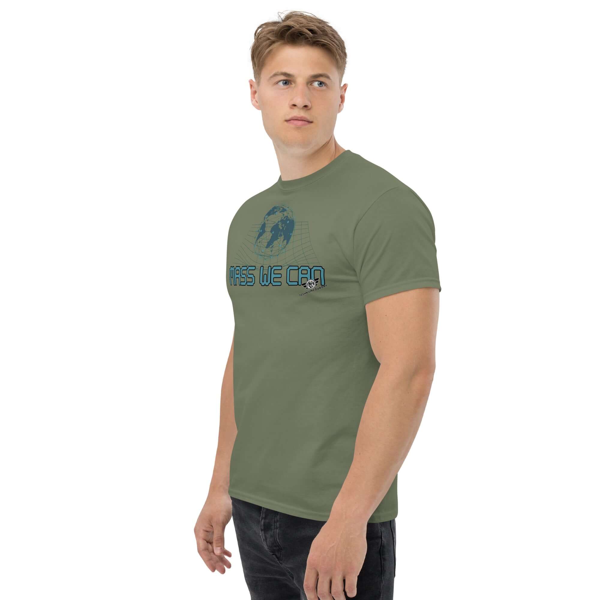 Model wearing olive "Mass We Can" physics t-shirt featuring Einstein's space-time curvature design and gravitational relativity humor.