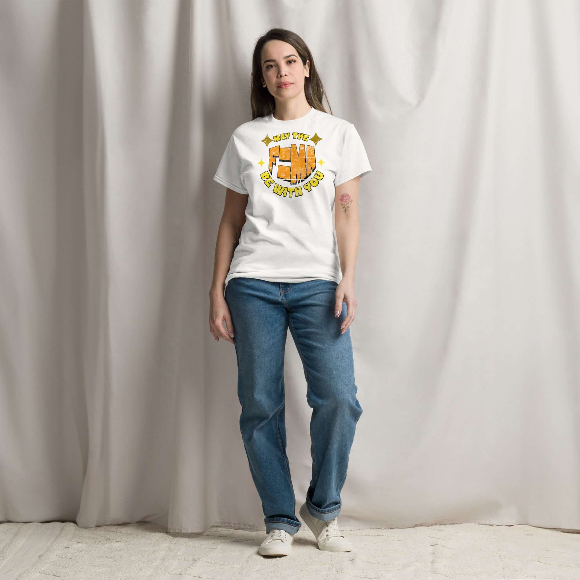 Woman wearing "May The F=MA Be With You" t-shirt; a humorous physics and sci-fi themed tee featuring Newton's Second Law of Motion.