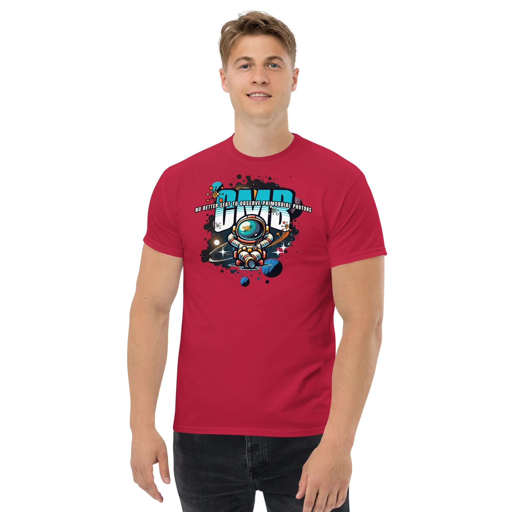 Man wearing red t-shirt with astronaut design, text 'NO BETTER SEAT TO OBSERVE PRIMORDIAL PHOTONS,' space theme.