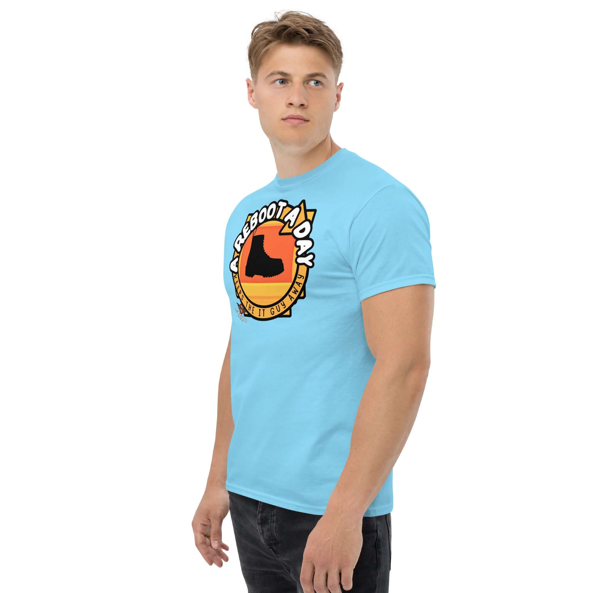Man wearing light blue "A Reboot A Day" IT support humor t-shirt with tech help desk boot design.