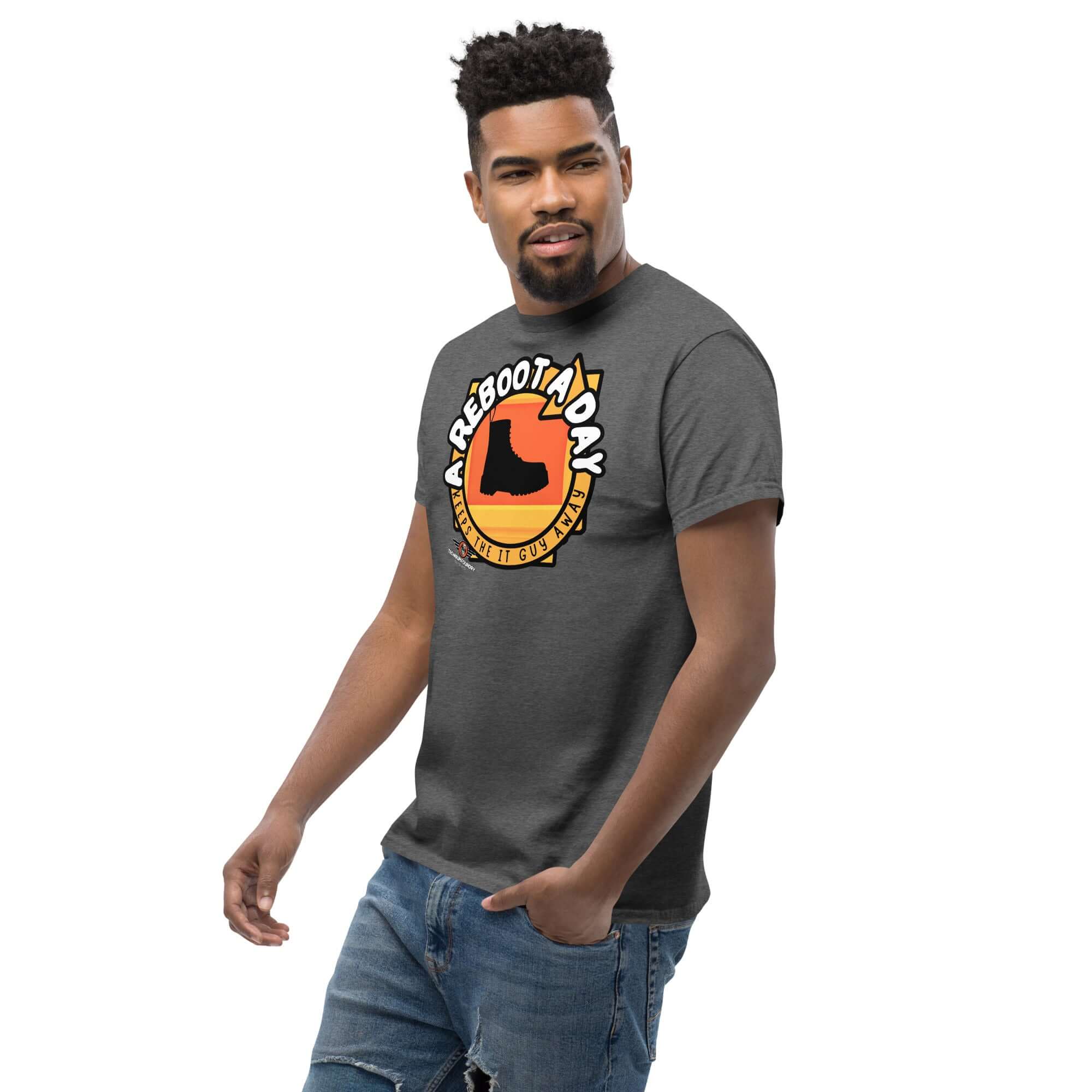 Man wearing "A Reboot A Day" IT Support Humor T-Shirt with boot design on gray shirt