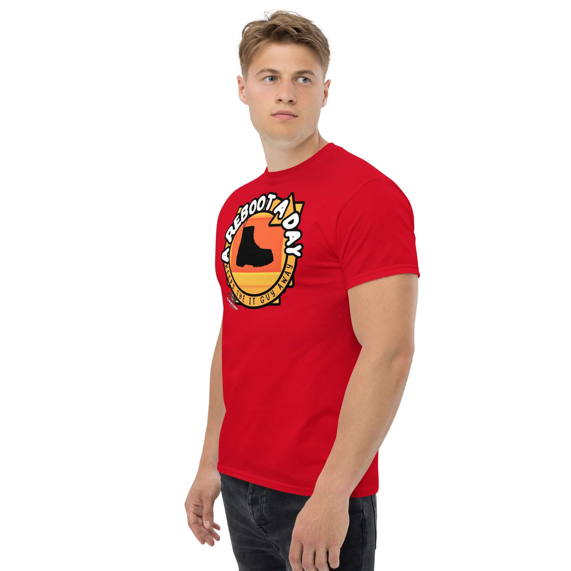 Red t-shirt featuring 'A Reboot A Day' IT support humor design with a combat boot silhouette and sunset backdrop. Tech help desk theme.