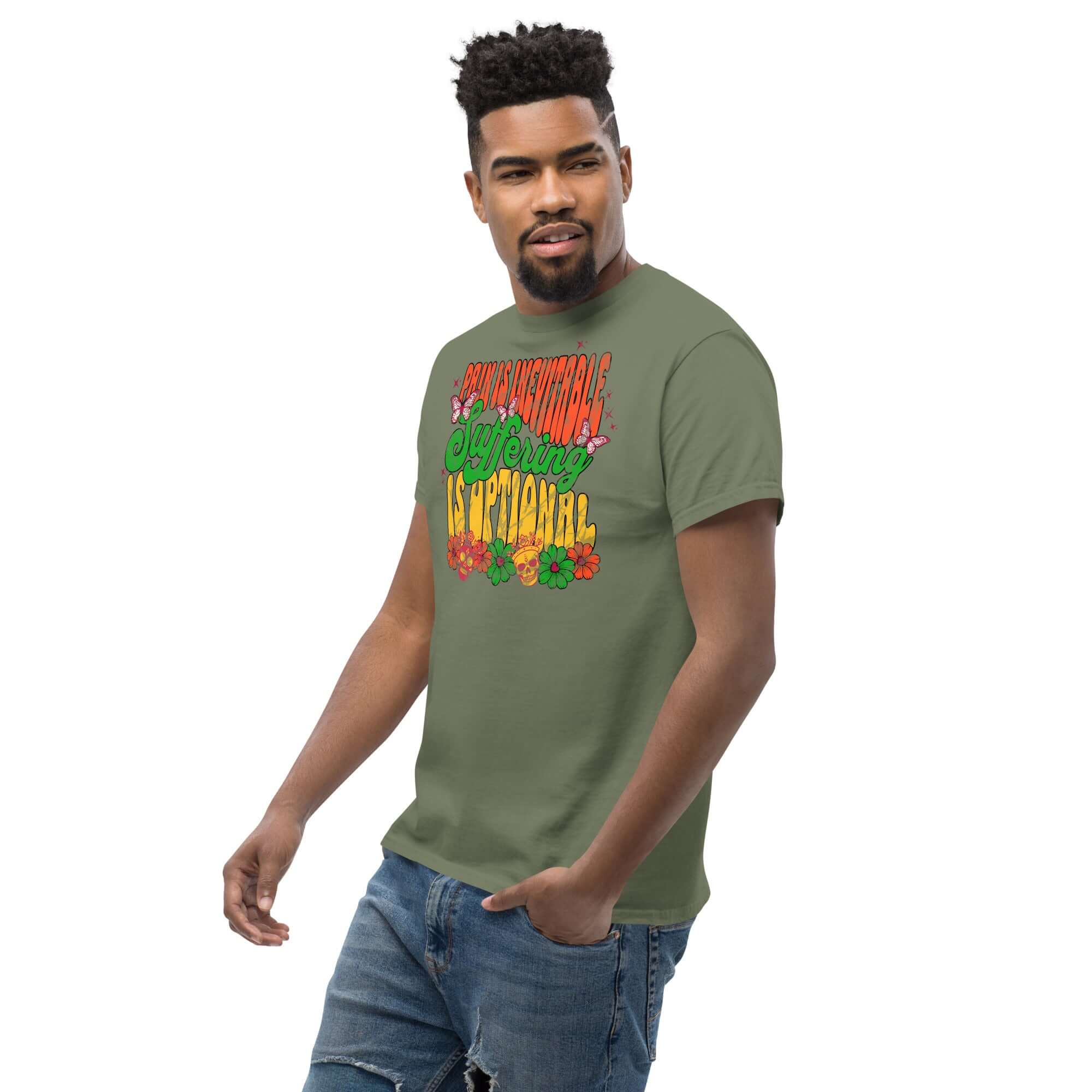 Man wearing 'Pain is Inevitable, Suffering is Optional' Stoic Philosophy Drip T-Shirt with colorful street art design.