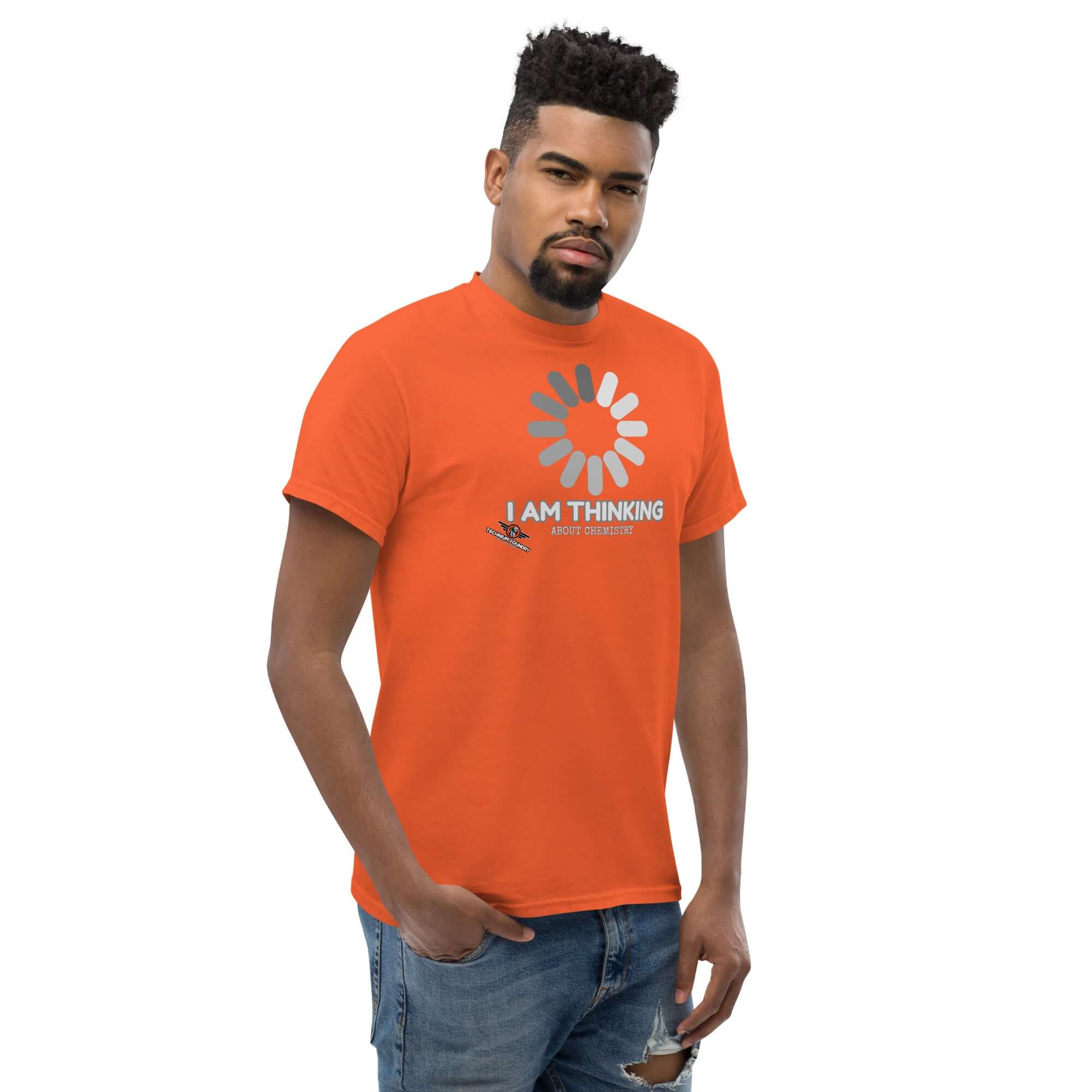 Man wearing orange t-shirt with loading screen graphic and 'I Am Thinking About Chemistry' text, symbolizing chemical reaction processes.