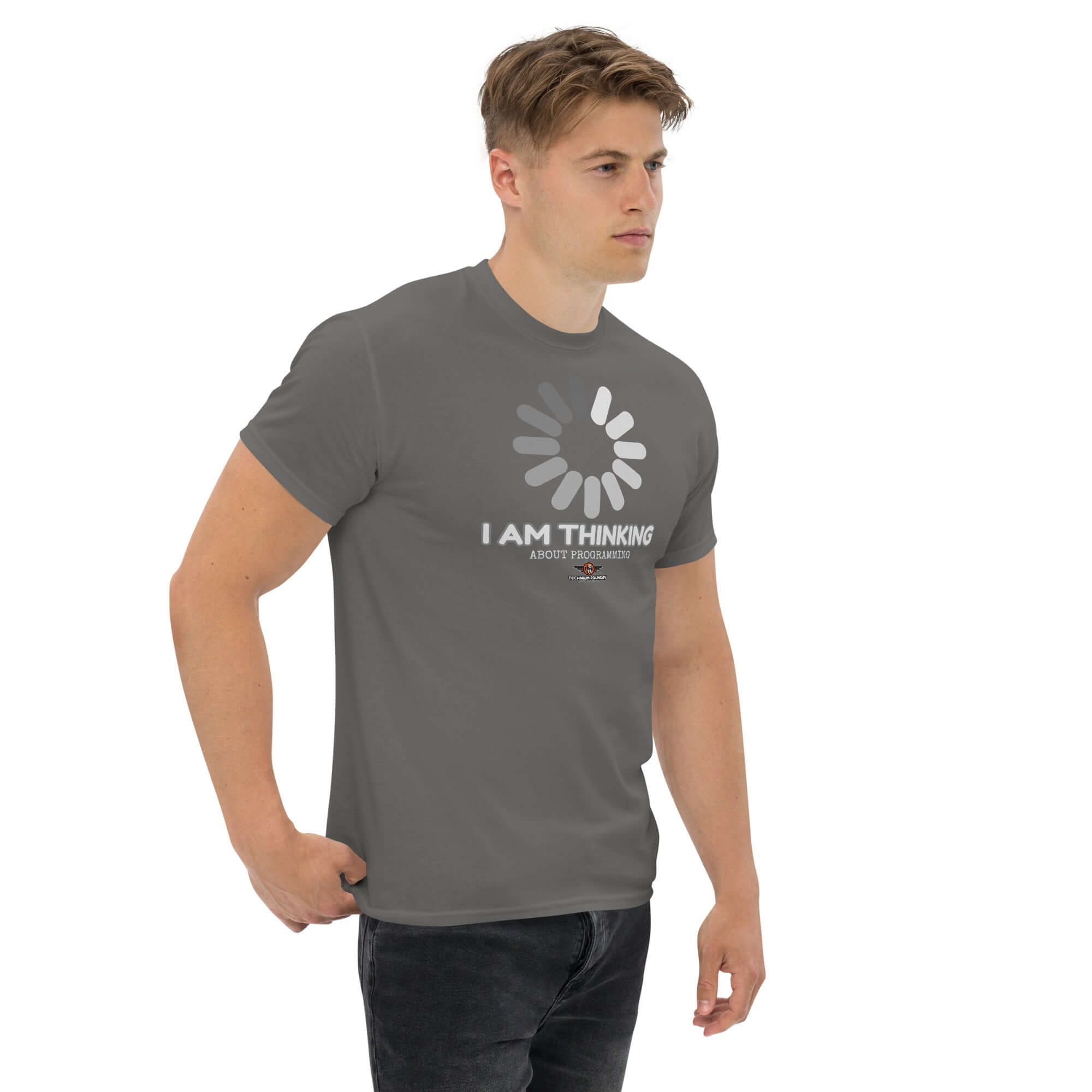 Alt Tag: Man wearing 'I Am Thinking About Programming' t-shirt with loading screen design, perfect for coders in need of a mental buffer.