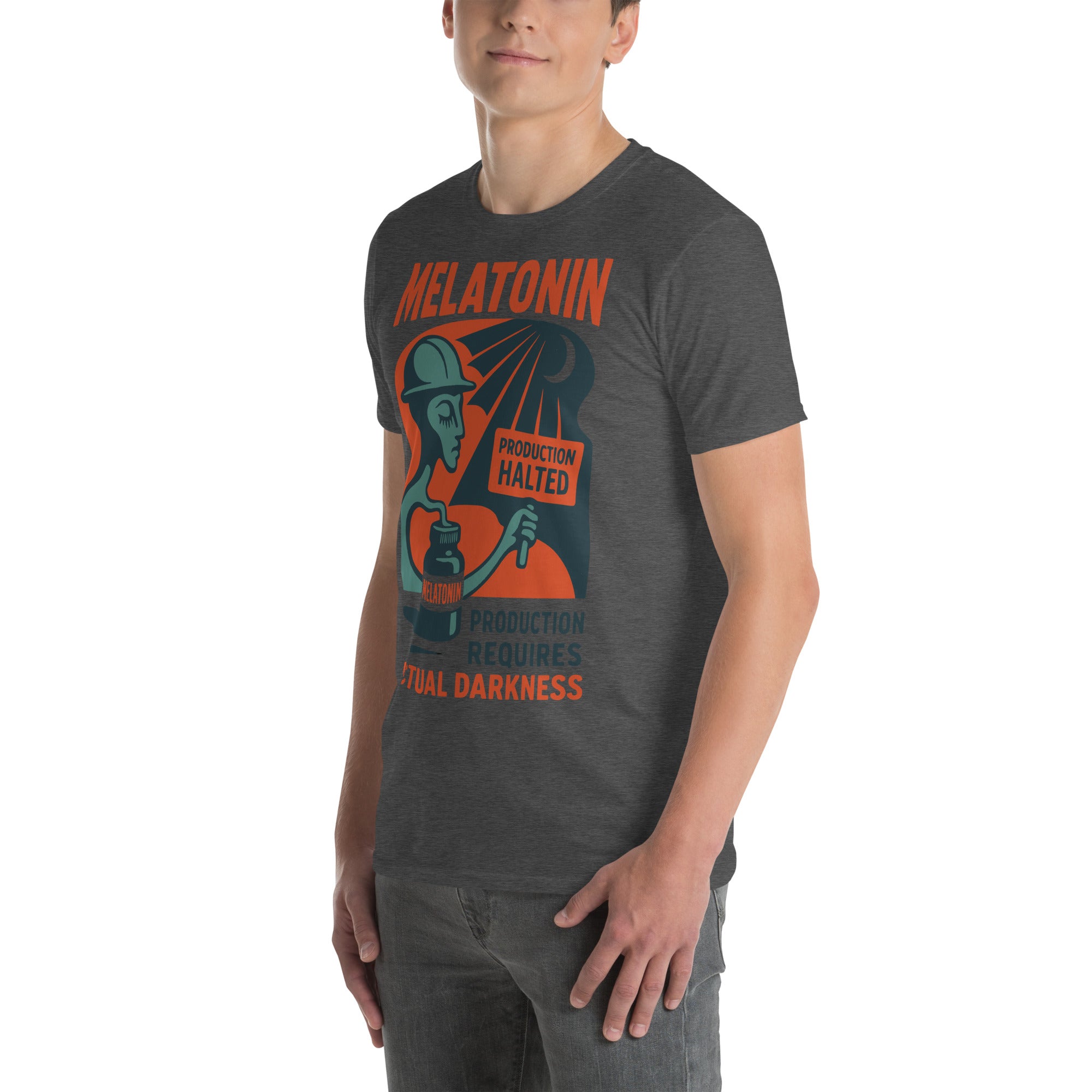 Man wearing a dark Melatonin T-shirt with 'Production Requires Actual Darkness' design, celebrating natural melatonin production.