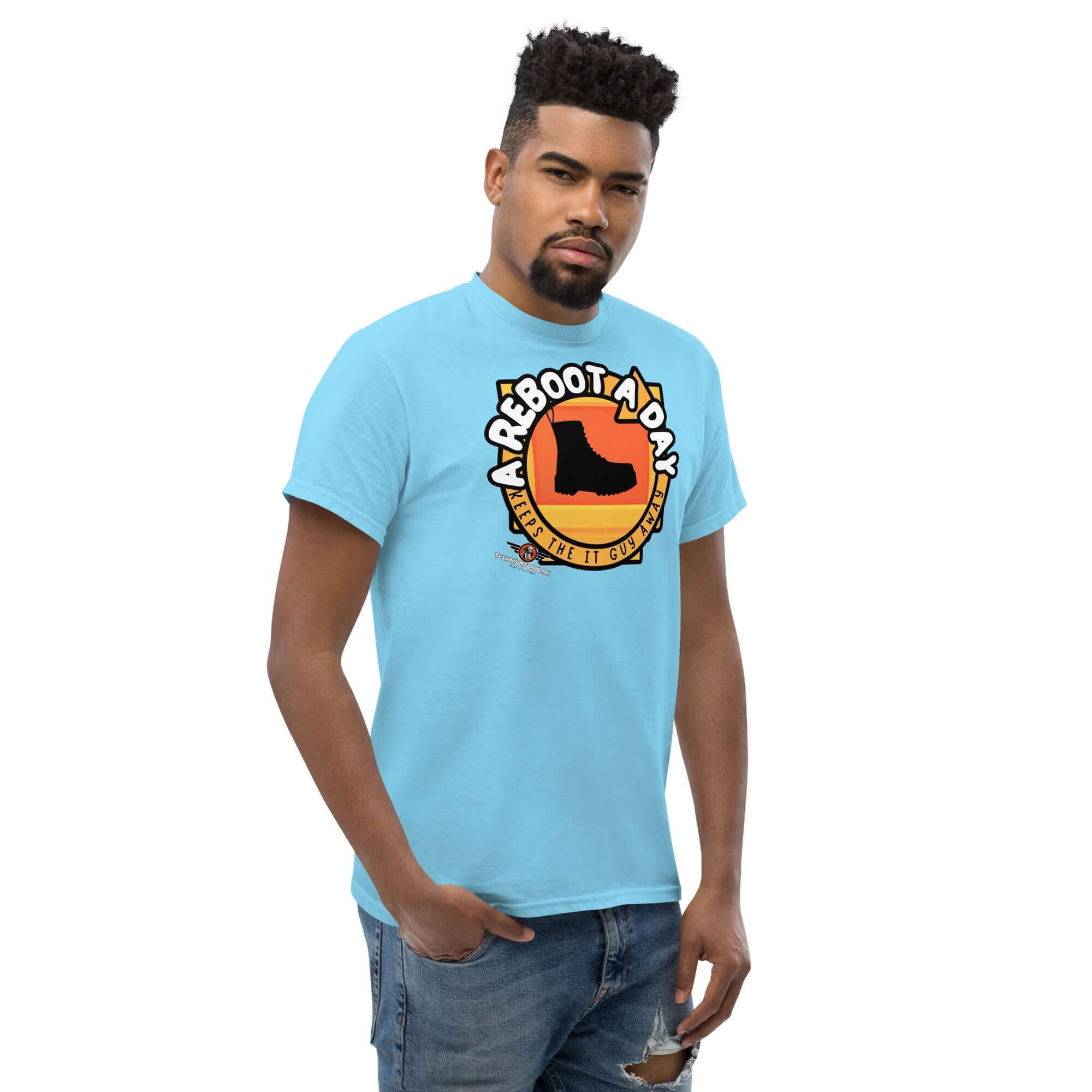 Man wearing "A Reboot A Day" IT support humor t-shirt with tech help desk boot design.