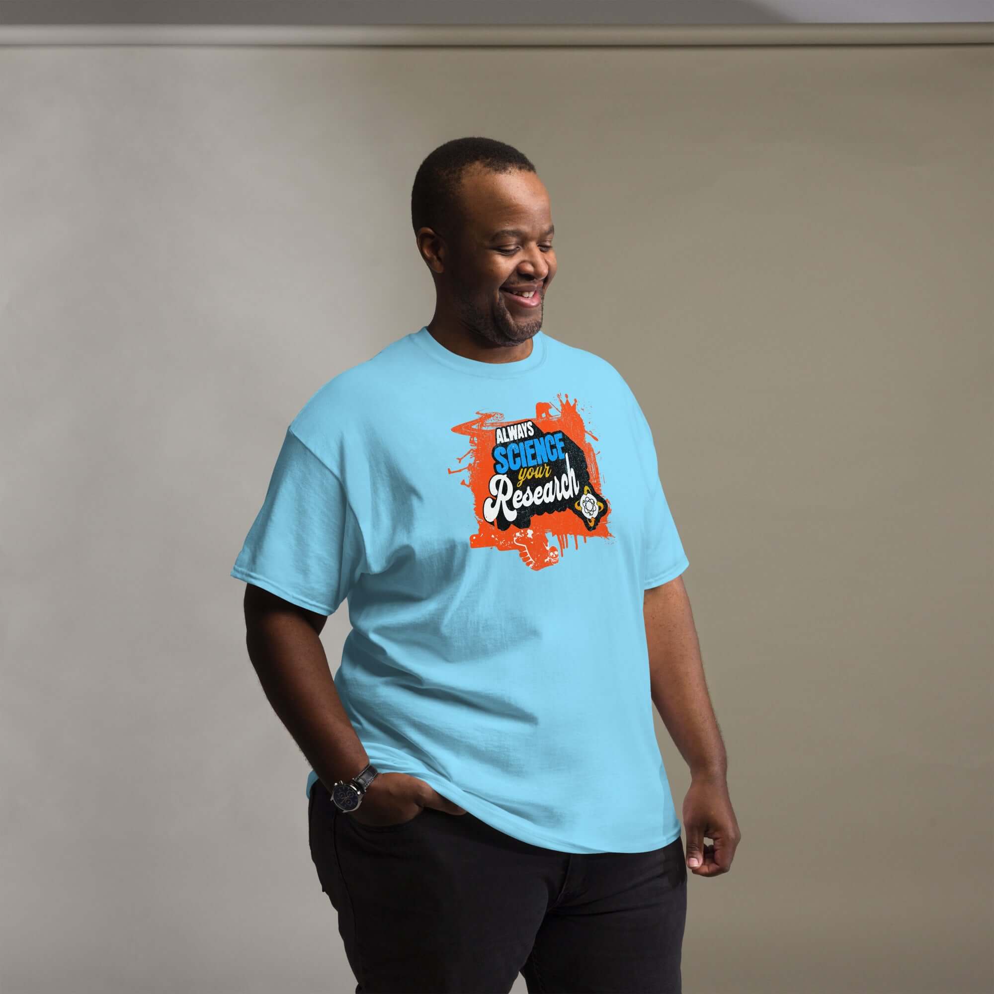 Man wearing light blue 'Always Science Your Research' t-shirt with vibrant design featuring the scientific method theme.