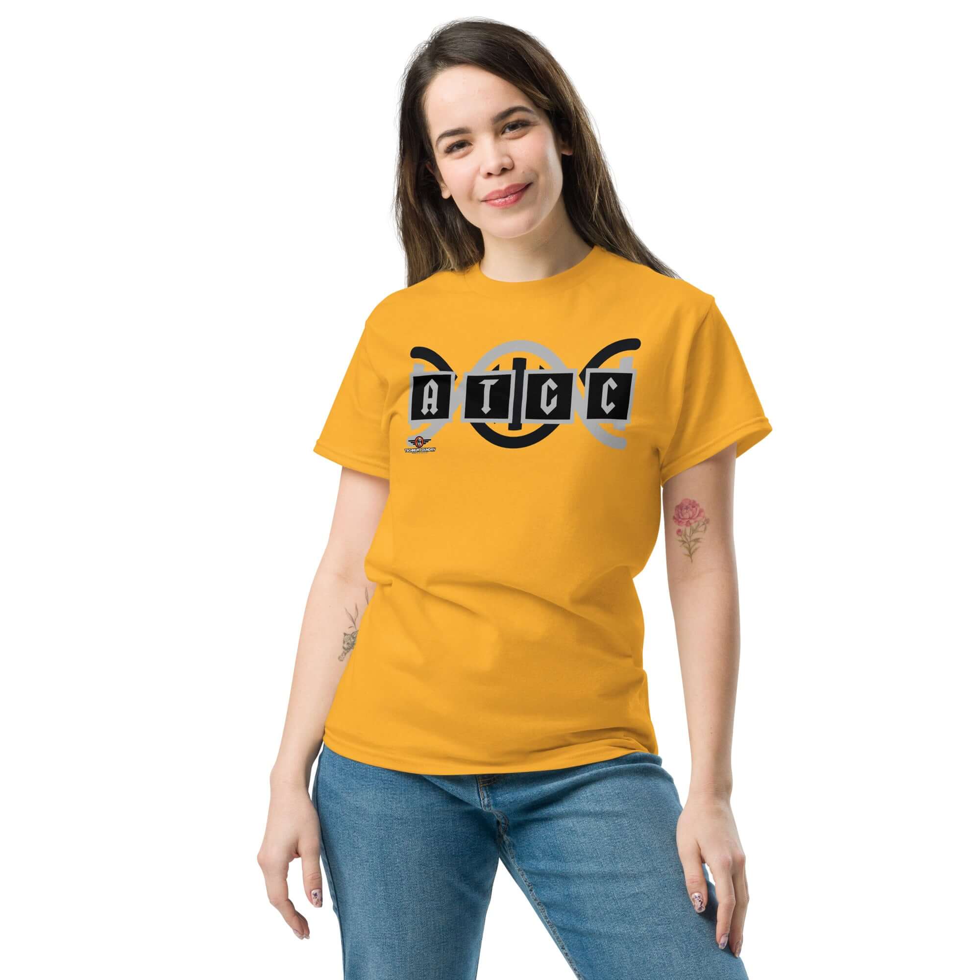 Person wearing yellow AT/GC Rock Band DNA T-Shirt featuring genetics science humor with metal band logo and DNA helix design.