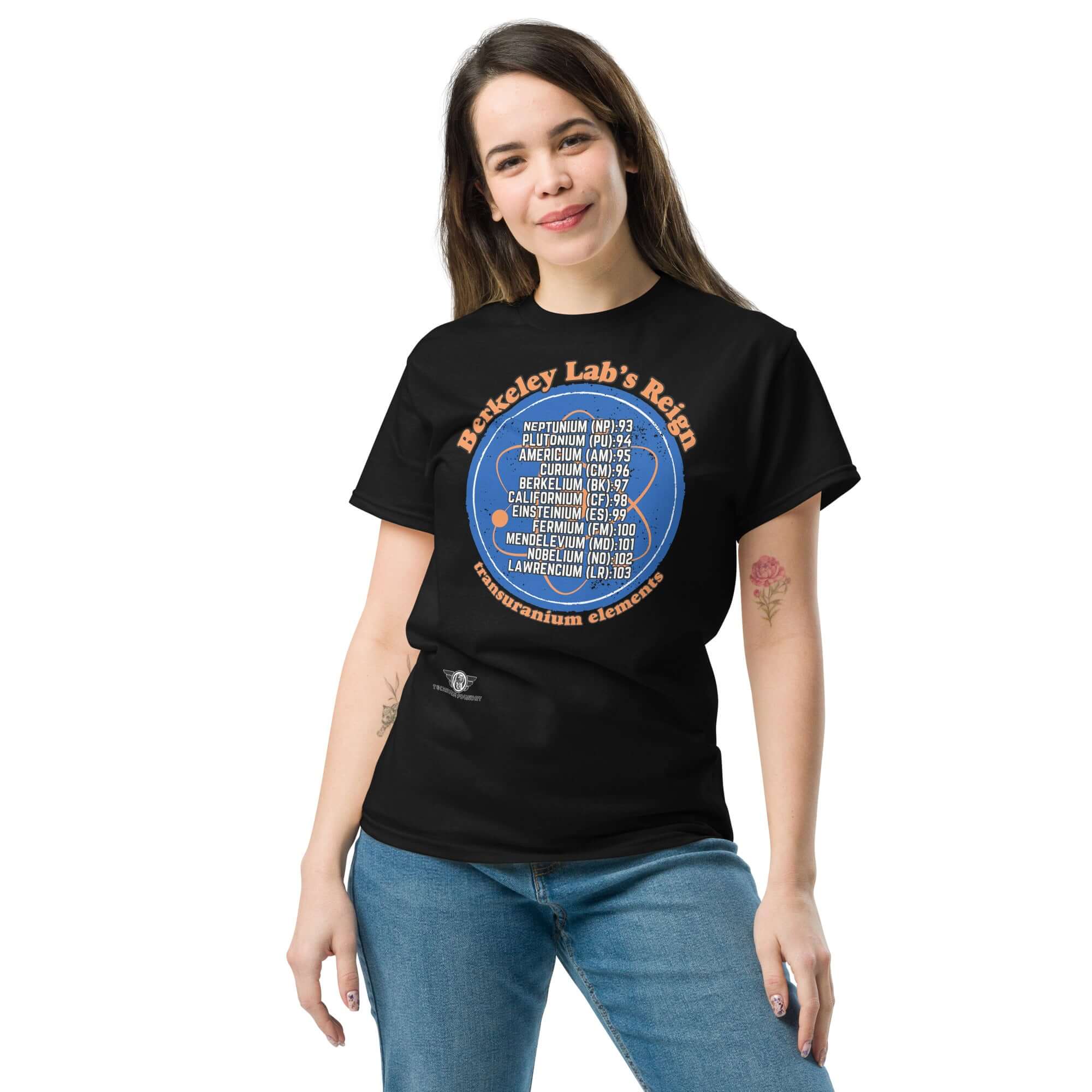 Woman wearing Berkeley Lab's Reign Transuranium Elements T-Shirt with scientific circle design in black and blue.