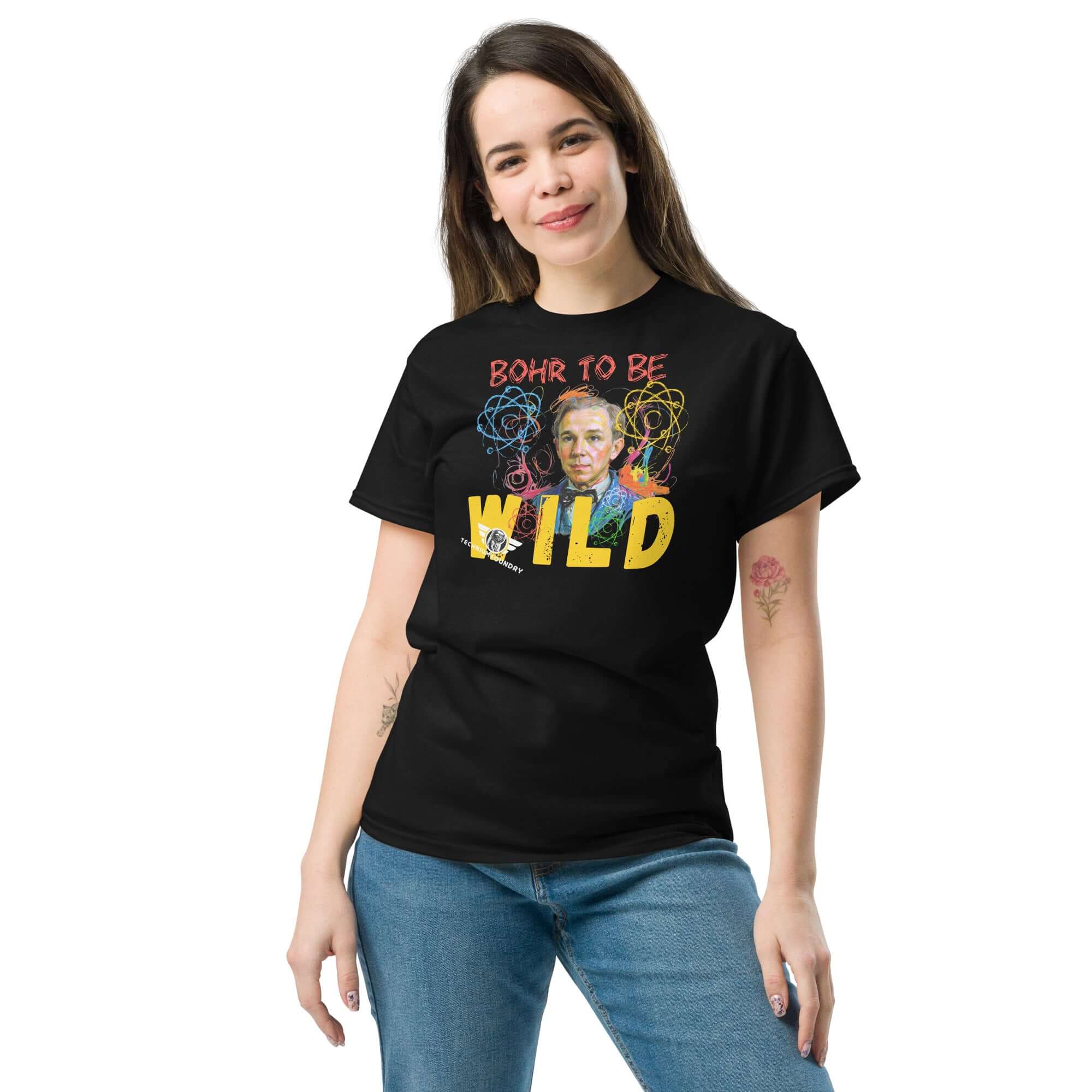Model wearing Bohr to Be Wild t-shirt featuring Niels Bohr's portrait with atomic energy theme, blending quantum physics and rock & roll art.