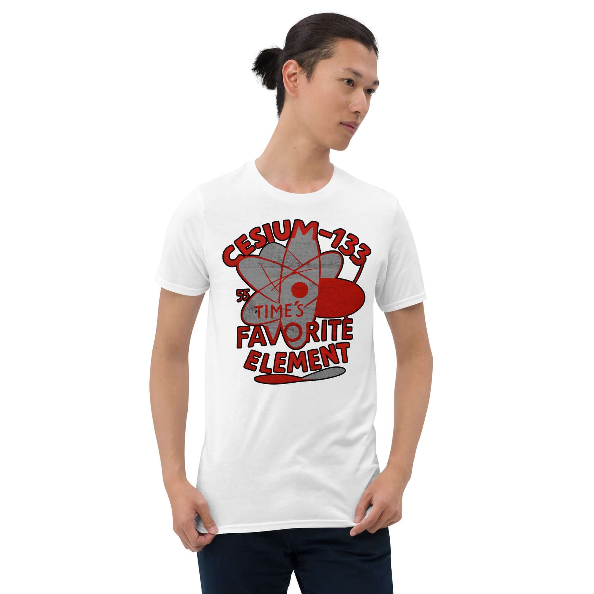 White t-shirt with Cesium-133 Atomic Clock design, featuring red text and circular blue graphics. Perfect for timekeeping enthusiasts.
