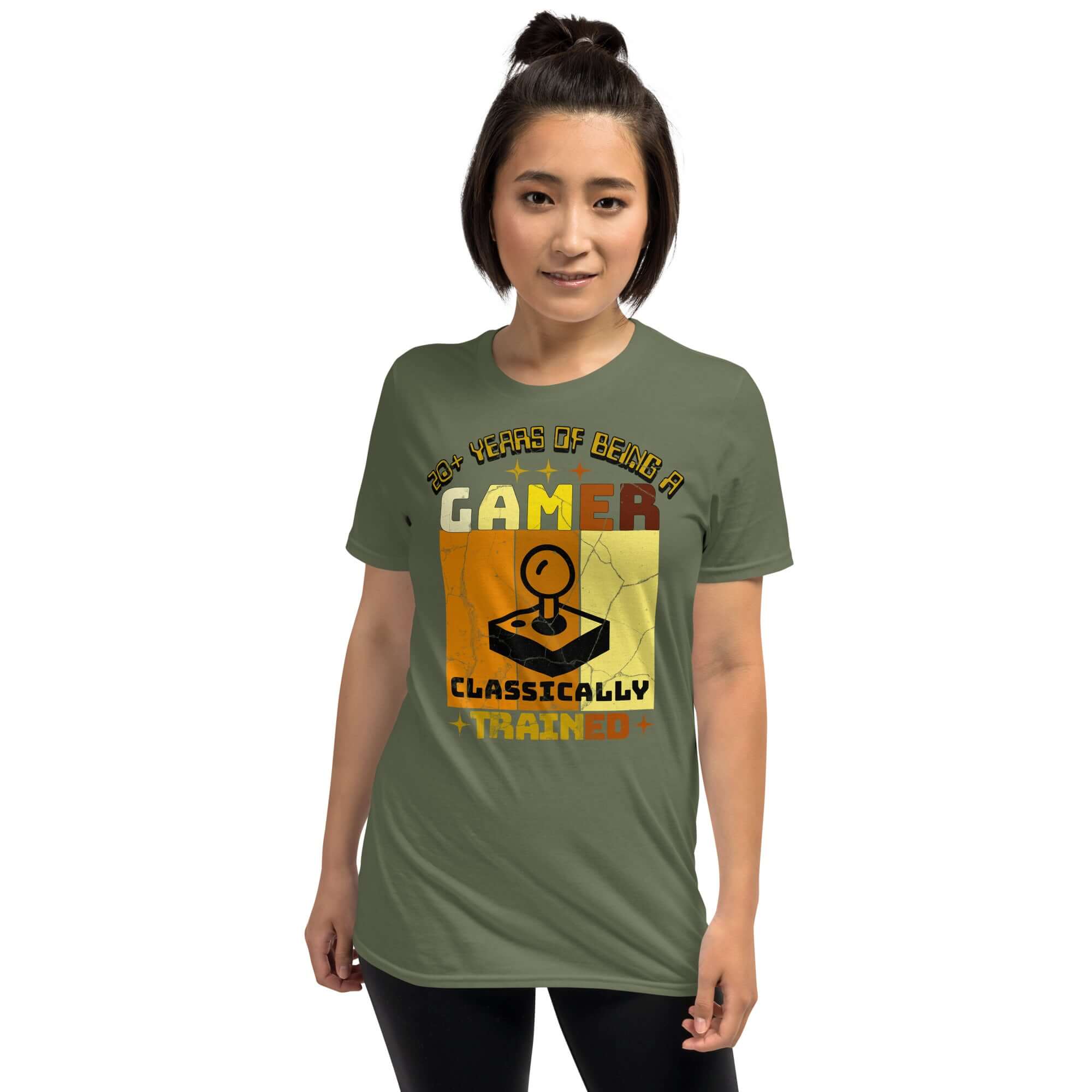 Woman wearing Classically Trained Gamer T-Shirt with retro controller design, celebrating 20+ years of gaming in green color.