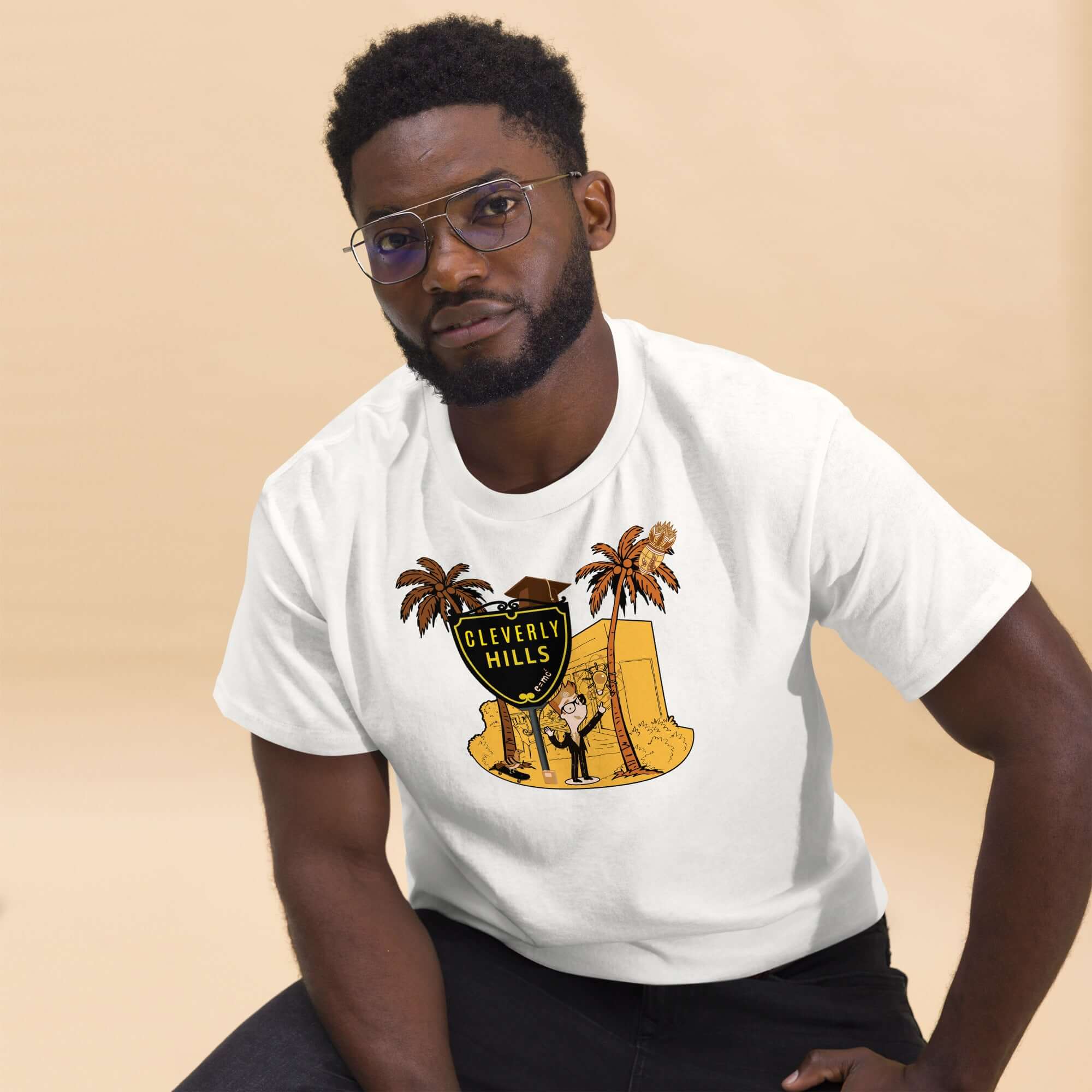 Man wearing Cleverly Hills E=mc² T-Shirt, featuring a science parody design with a Beverly Hills themed shield sign.