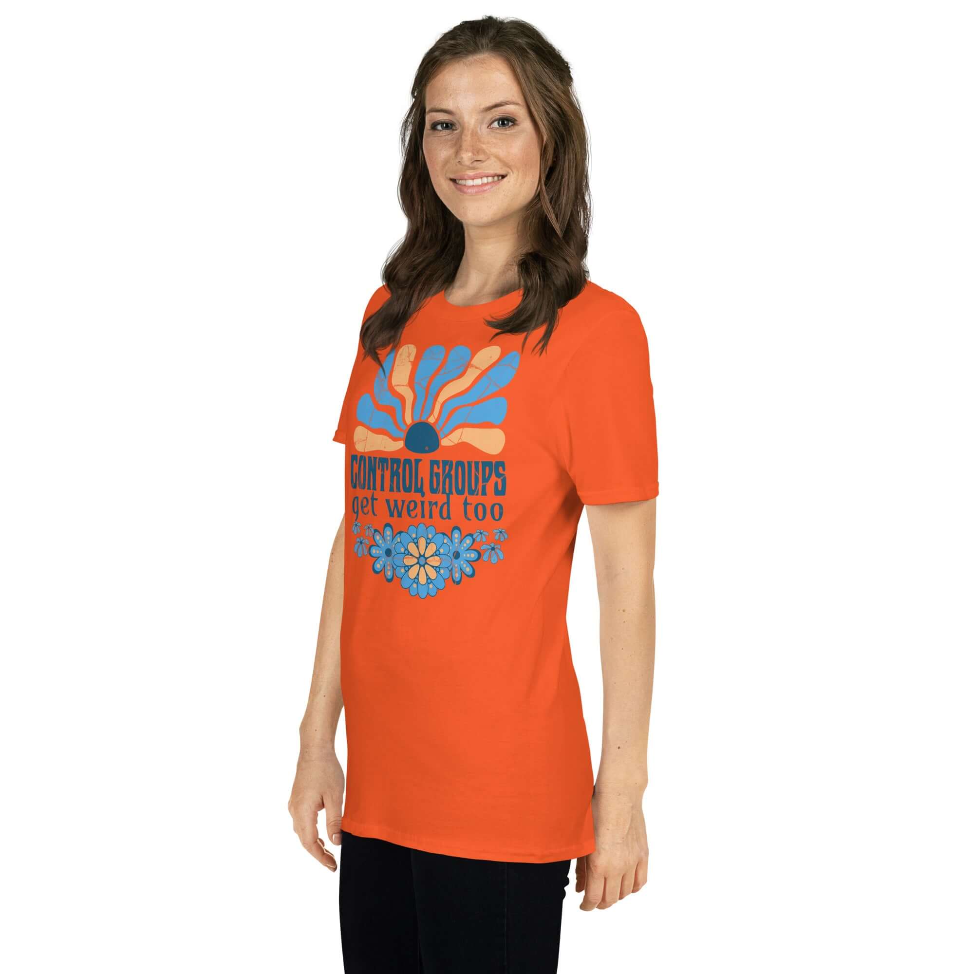 Alt Tag: Woman wearing "Control Groups Get Weird Too" t-shirt with 70s-inspired blue and orange sunburst design. Retro science humor.