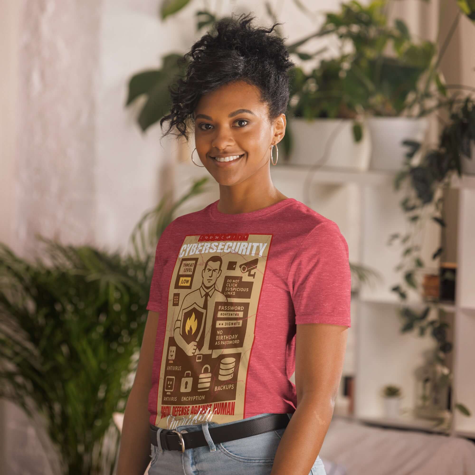 Woman wearing red Cybersecurity T-Shirt with vintage design "Digital Defense Against Human Stupidity" in indoor setting.