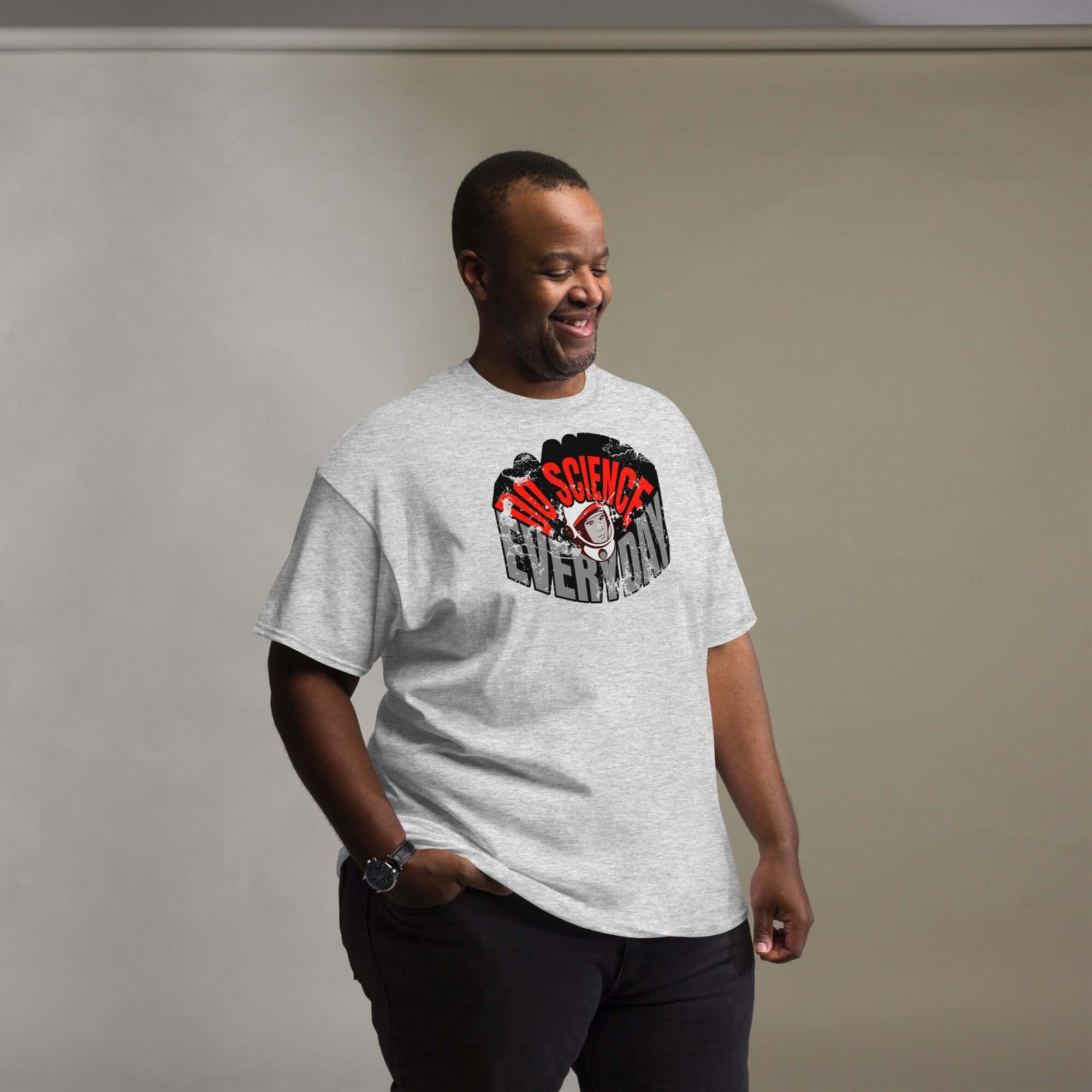 Man wearing Do Science Every Day T-Shirt with astronaut graphic, representing a blend of space and fashion.
