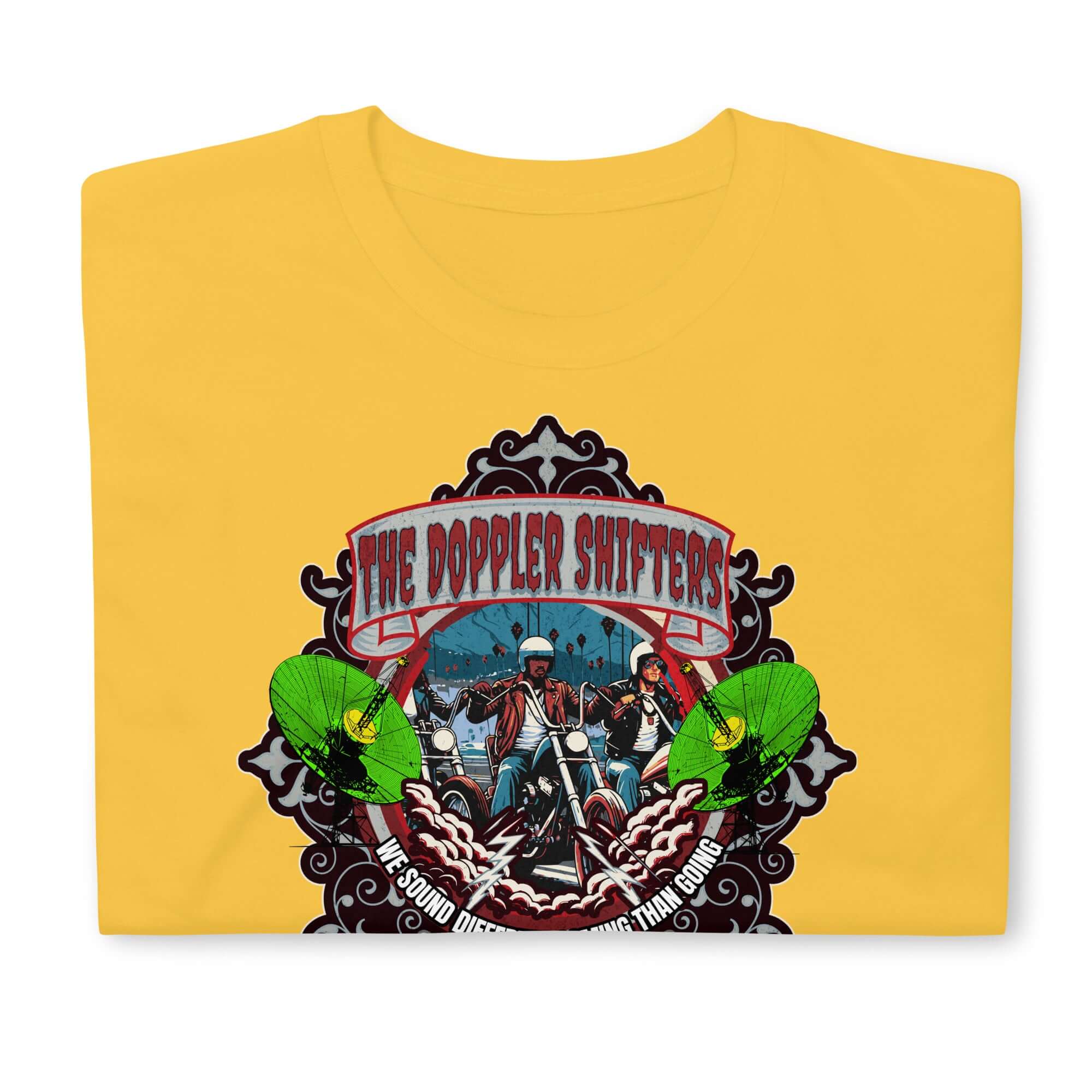 The Doppler Shifters Motorcycle Club T-Shirt with colorful emblem of riders, green accents, and ornate border on yellow background.