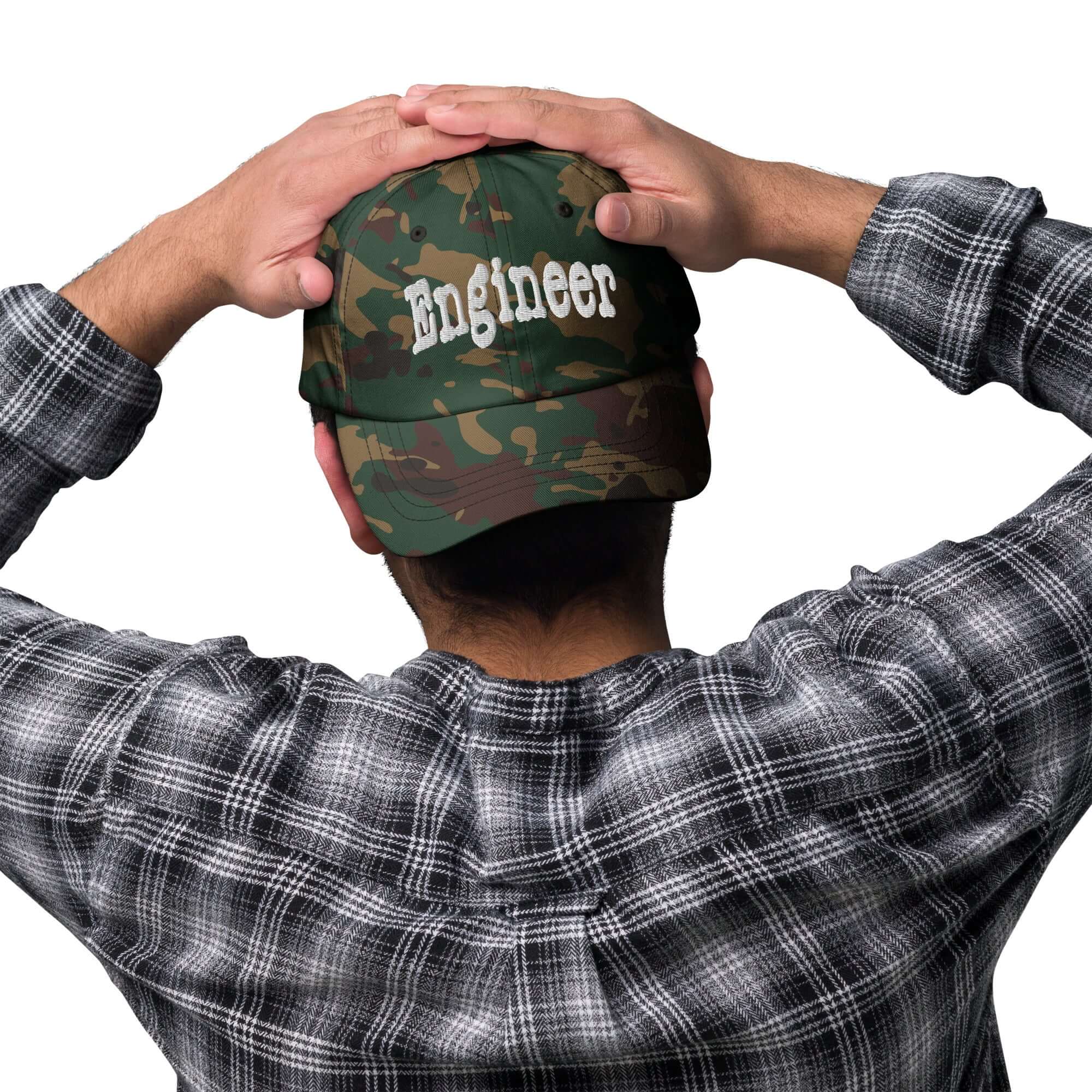 Back view of person wearing camo Engineer baseball cap, promoting problem-solving and professional style.