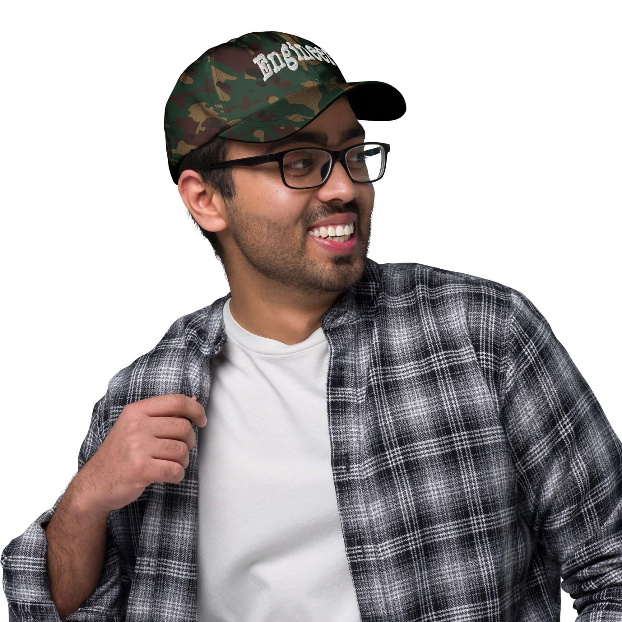 Smiling person wearing an "ENGINEER" baseball cap, showcasing professional problem-solving headwear for optimal style.