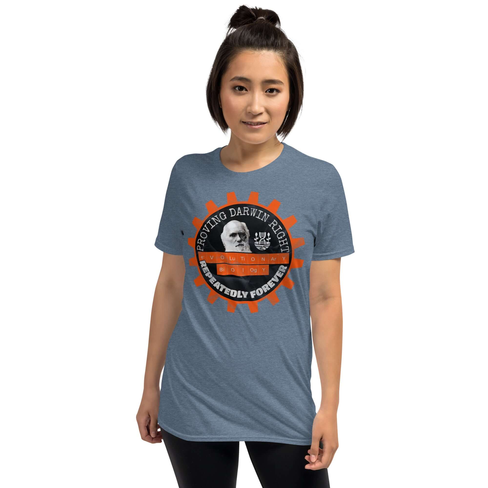 Woman wearing Evolutionary Biology T-Shirt with 'Proving Darwin Right' graphic featuring Charles Darwin.