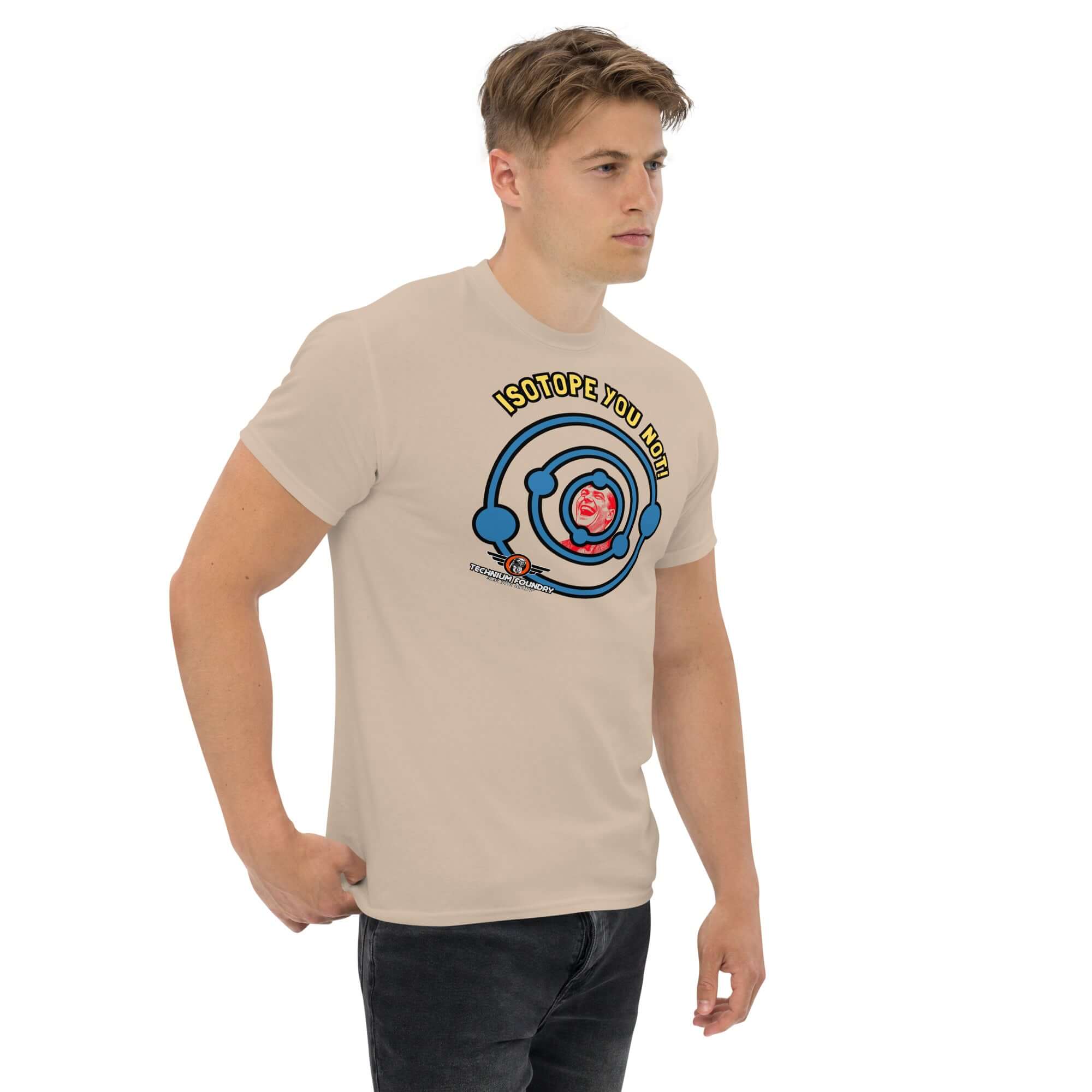Man wearing a beige "Isotope You Not!" t-shirt with nuclear chemistry pun design, featuring electron shells and a playful atomic theme.
