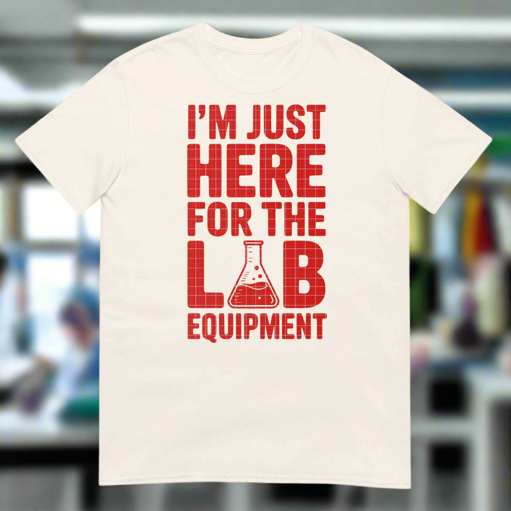 White T-shirt with red text "I'm Just Here For The Lab Equipment" and laboratory flask graphic, scientific humor apparel.