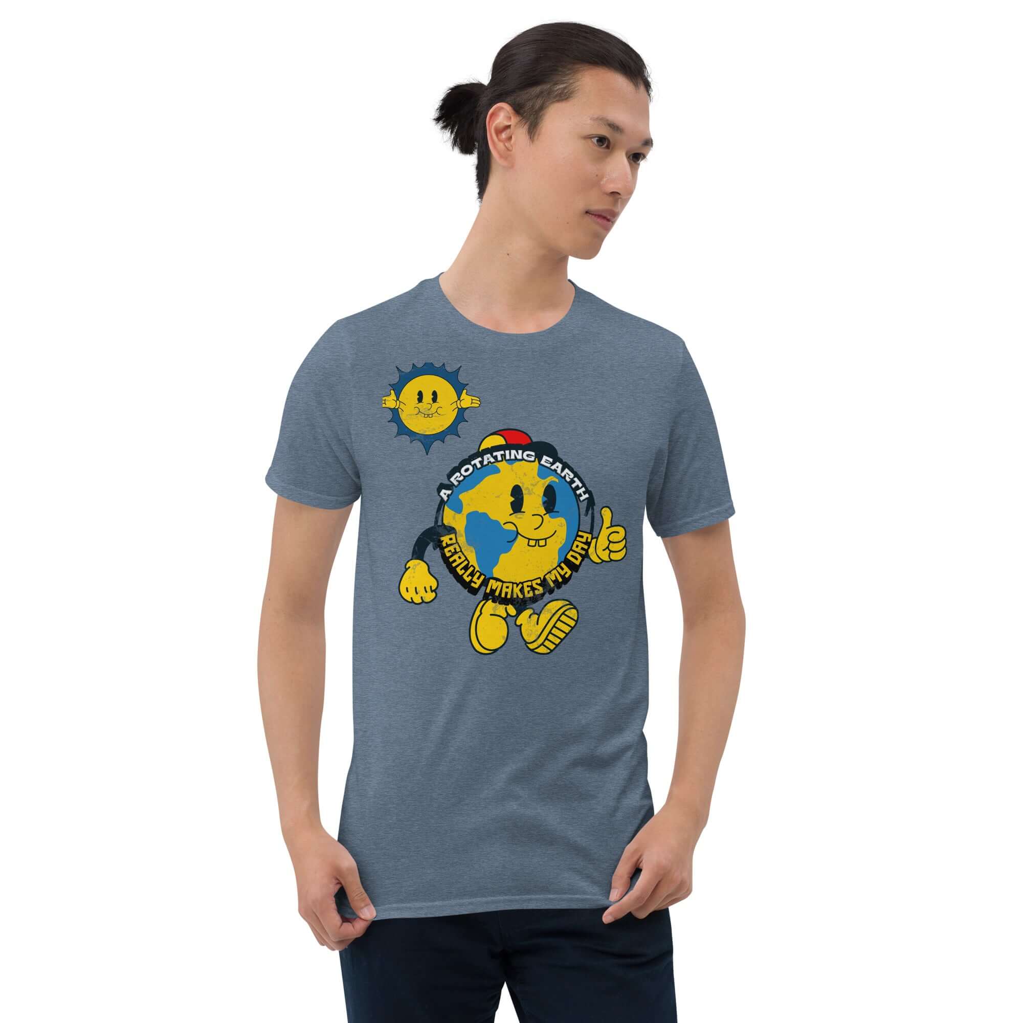 Man wearing blue t-shirt with cartoon Earth and "A Rotating Earth Really Makes My Day!" slogan, from Cheerful Planet Apparel.