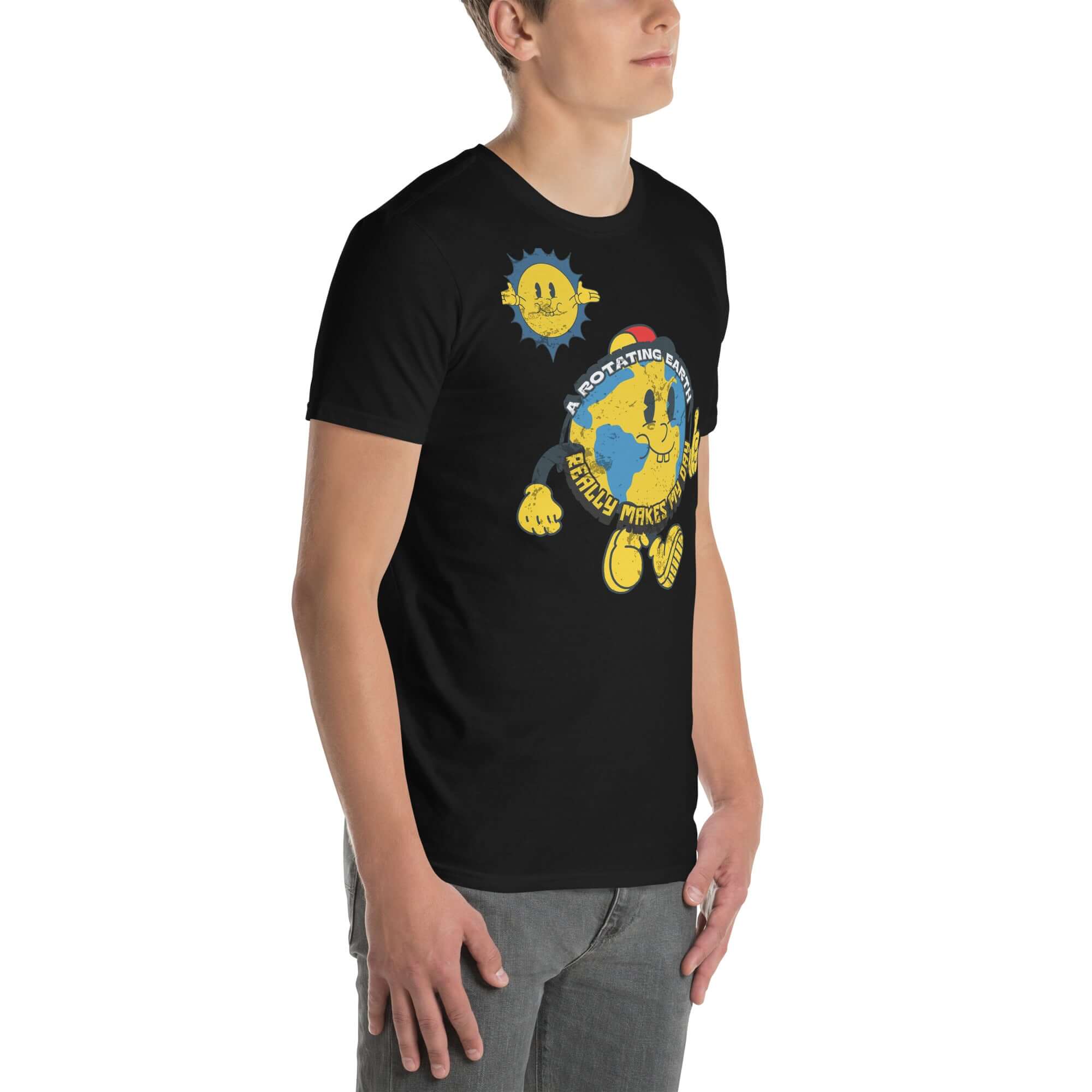 Man wearing a black t-shirt with cartoon Earth and sun design, featuring the phrase 'A Rotating Earth Really Makes My Day!' from Cheerful Planet Apparel.
