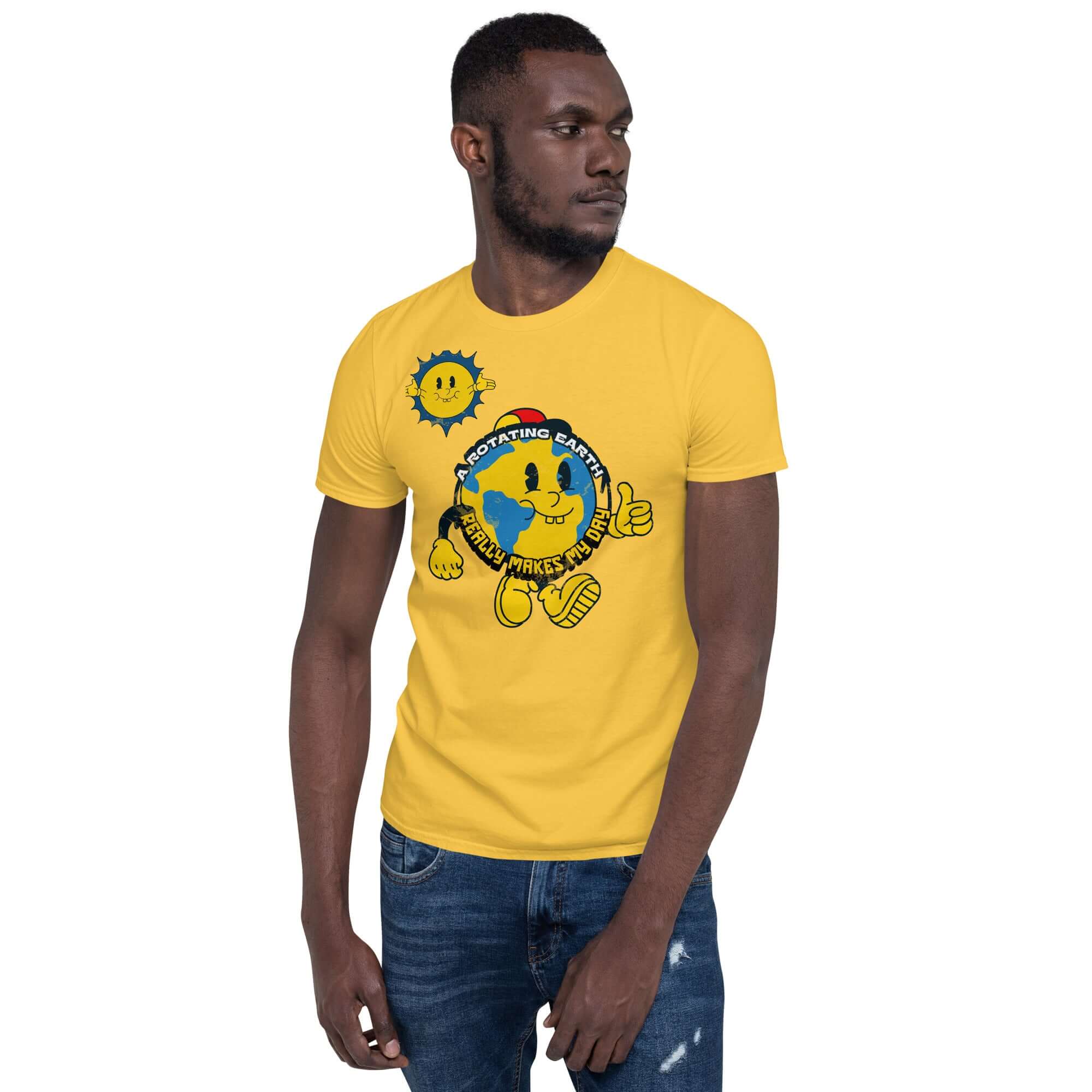 Man wearing "A Rotating Earth Really Makes My Day" yellow t-shirt with cartoon Earth character, from Cheerful Planet Apparel.