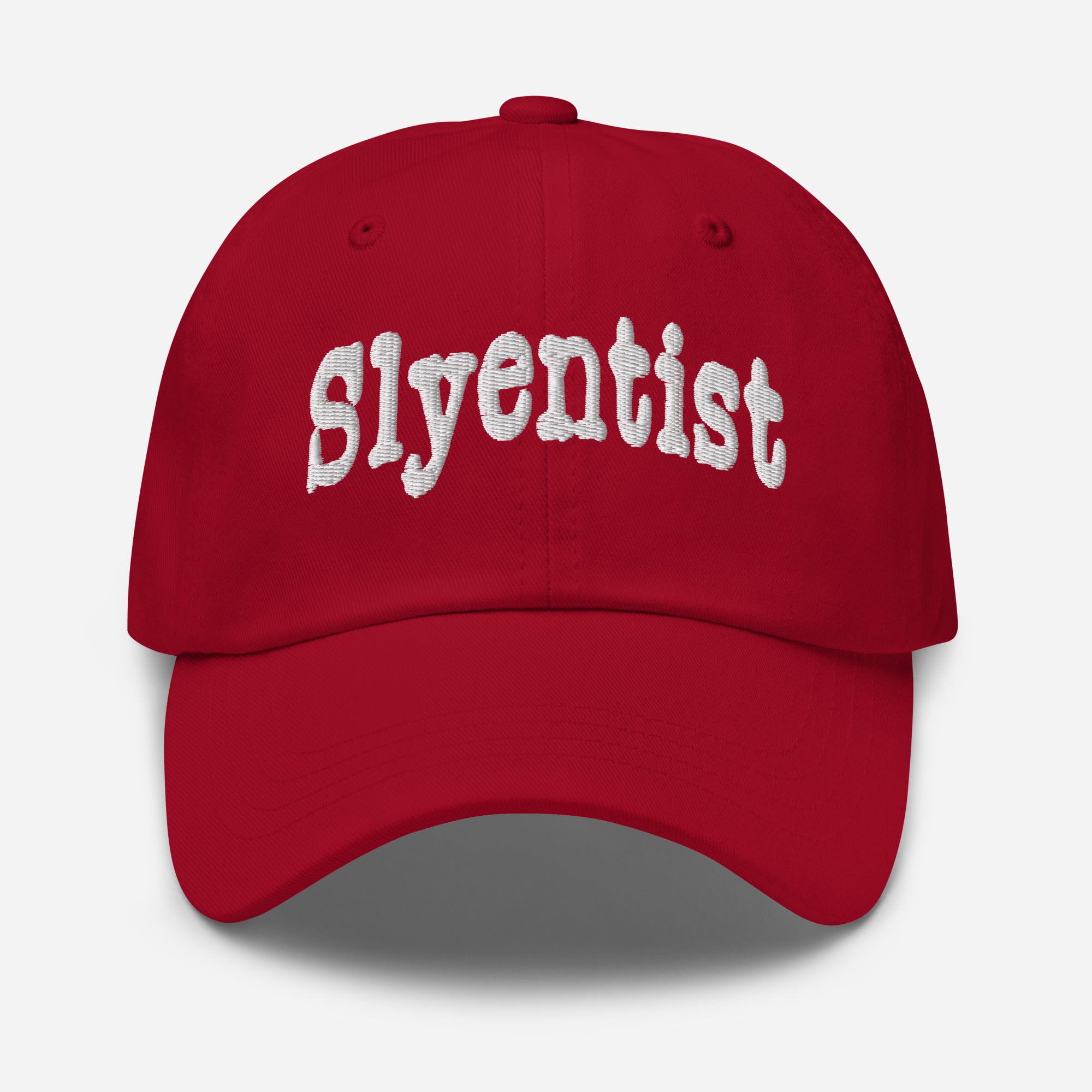 Red Slyentist baseball cap featuring bold white embroidered text for science professionals with a playful mischievous flair.
