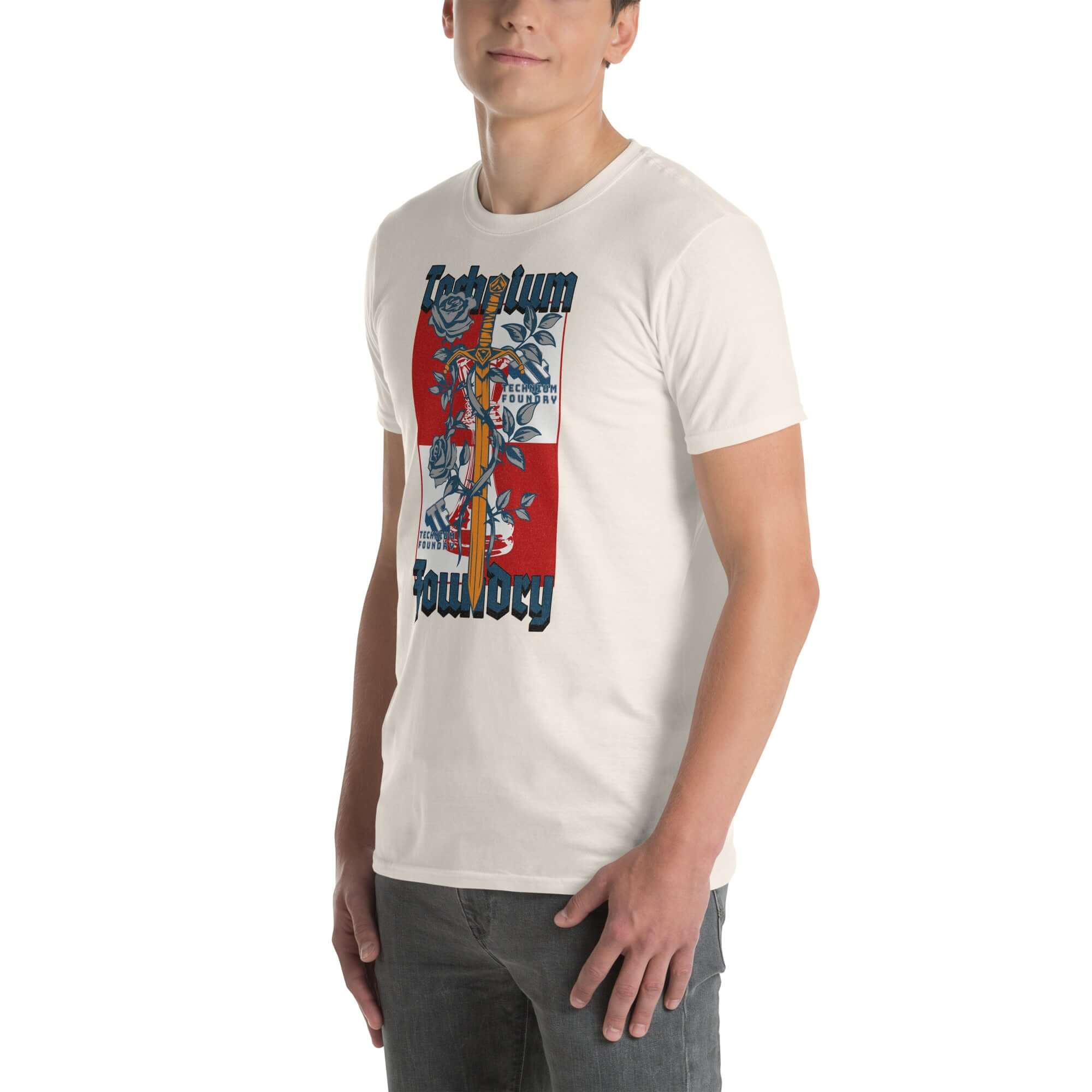 Man wearing Technium Foundry Logo T-Shirt, vibrant orange intellectual emblem tee, standing with graphic design in front.