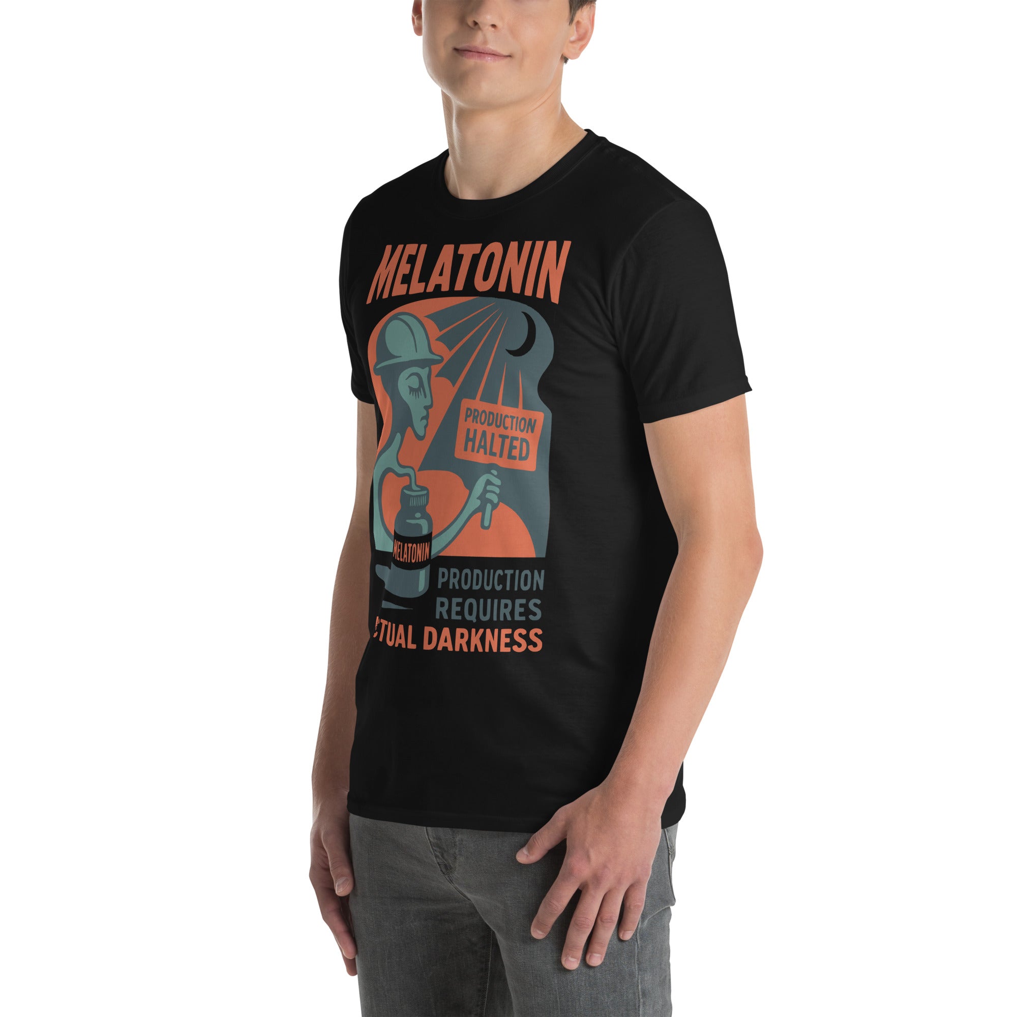 Man wearing black t-shirt featuring Melatonin: Production Requires Actual Darkness design with industrial theme.