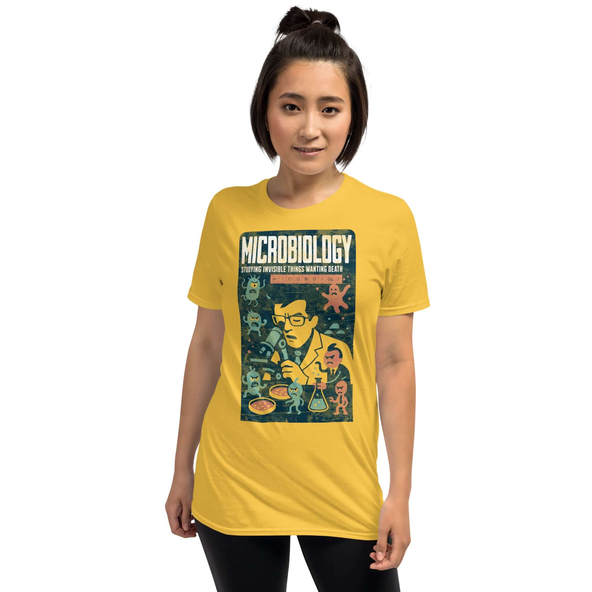 Person wearing a yellow Microbiology T-shirt featuring a humorous design about studying microorganisms.