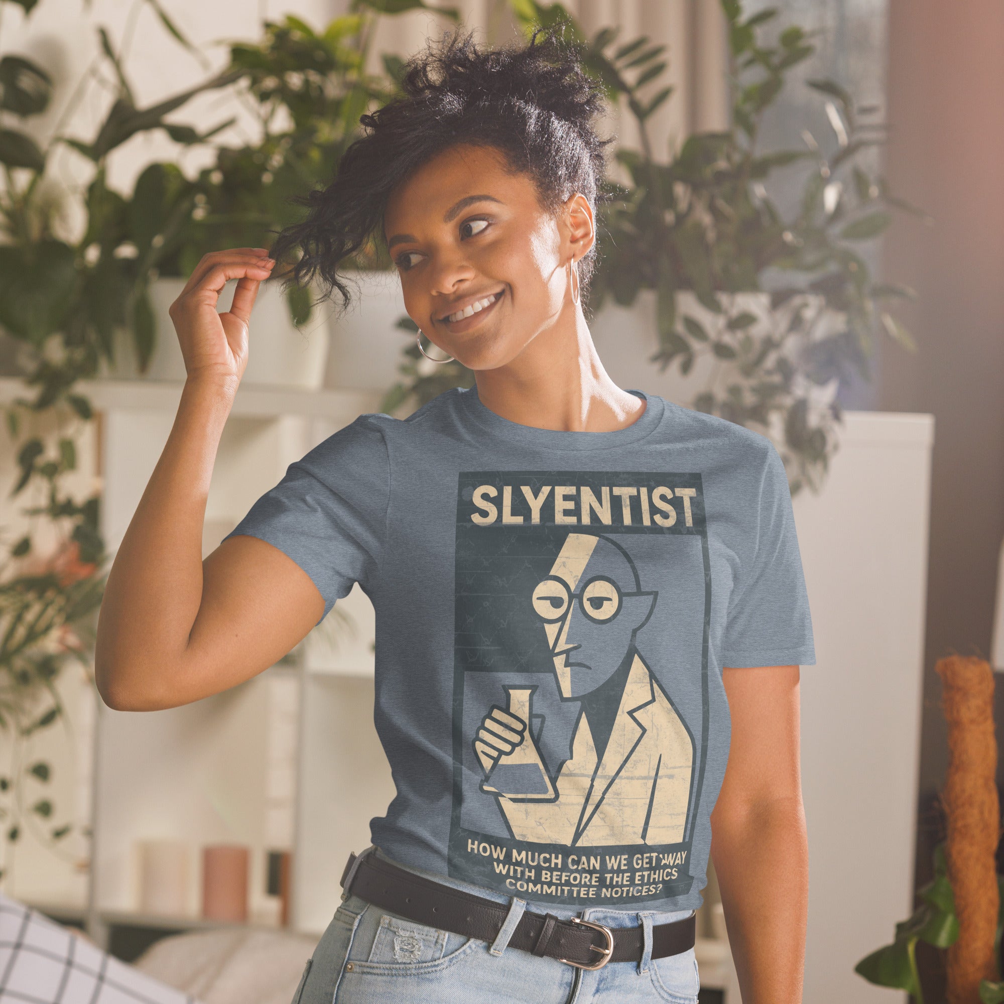 Woman wearing 'Sly-entist' T-shirt featuring scientific humor design in a cozy room with plants.