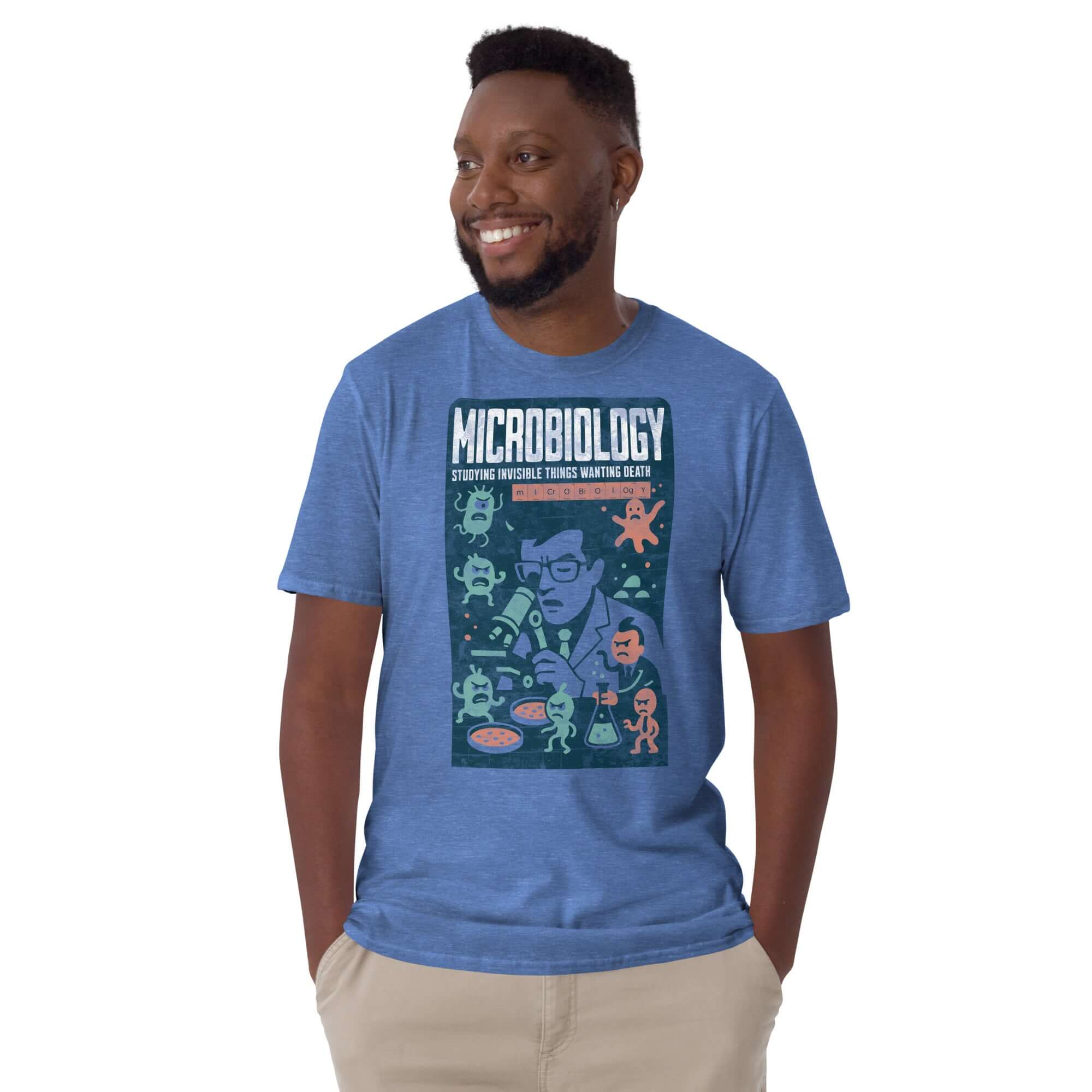 Blue Microbiology T-shirt featuring a humorous design about studying microscopic entities, worn by a smiling man.