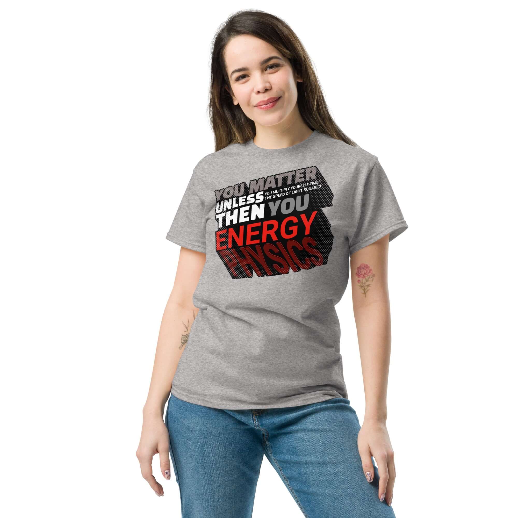Woman wearing a gray t-shirt featuring a typographic design of Einstein's E=mc² with physics humor text: "You Matter Then You Energy."